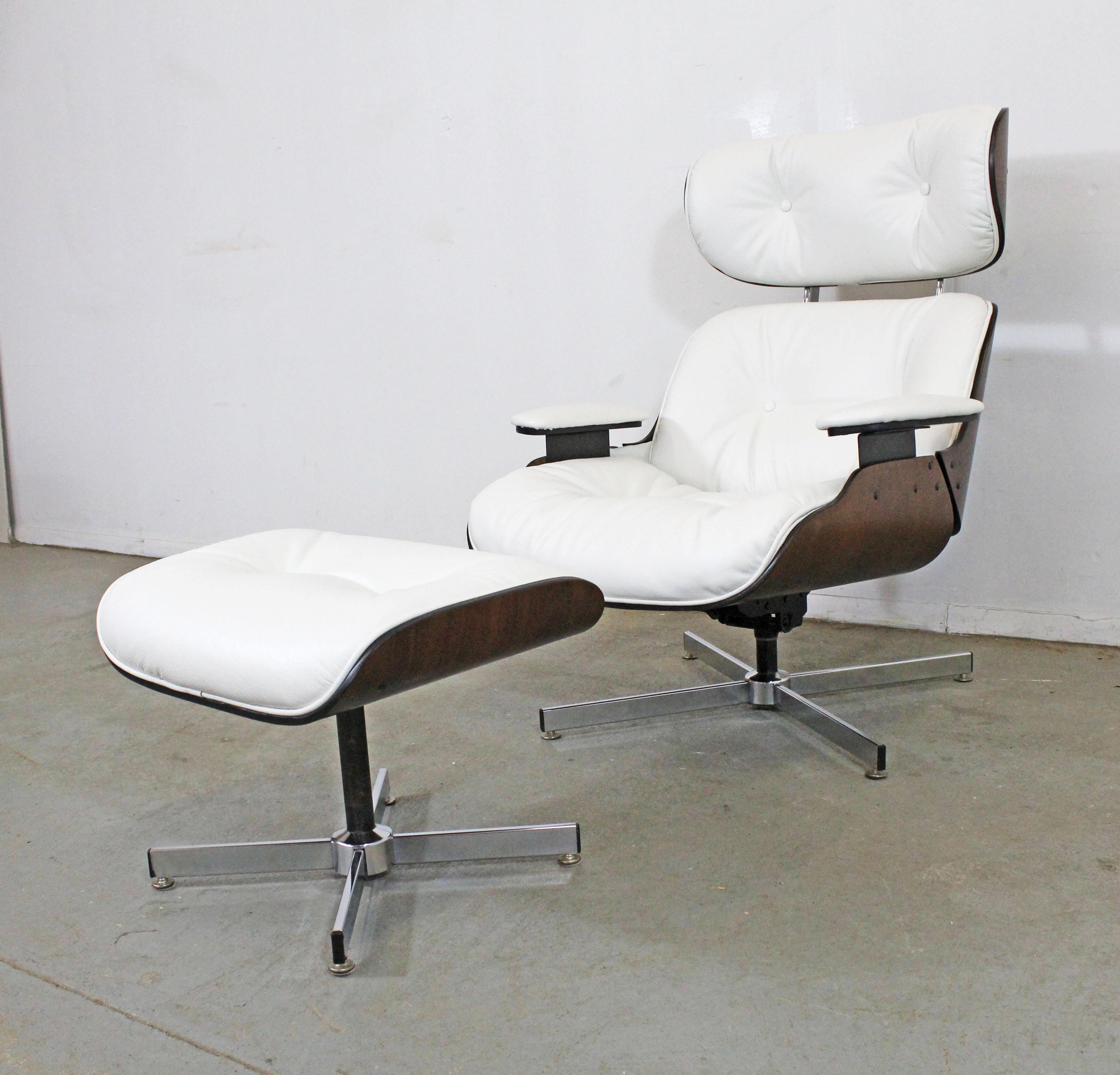Offered is a beautifully restored Selig lounge chair and ottoman that swivels. This set has been reupholstered in 
