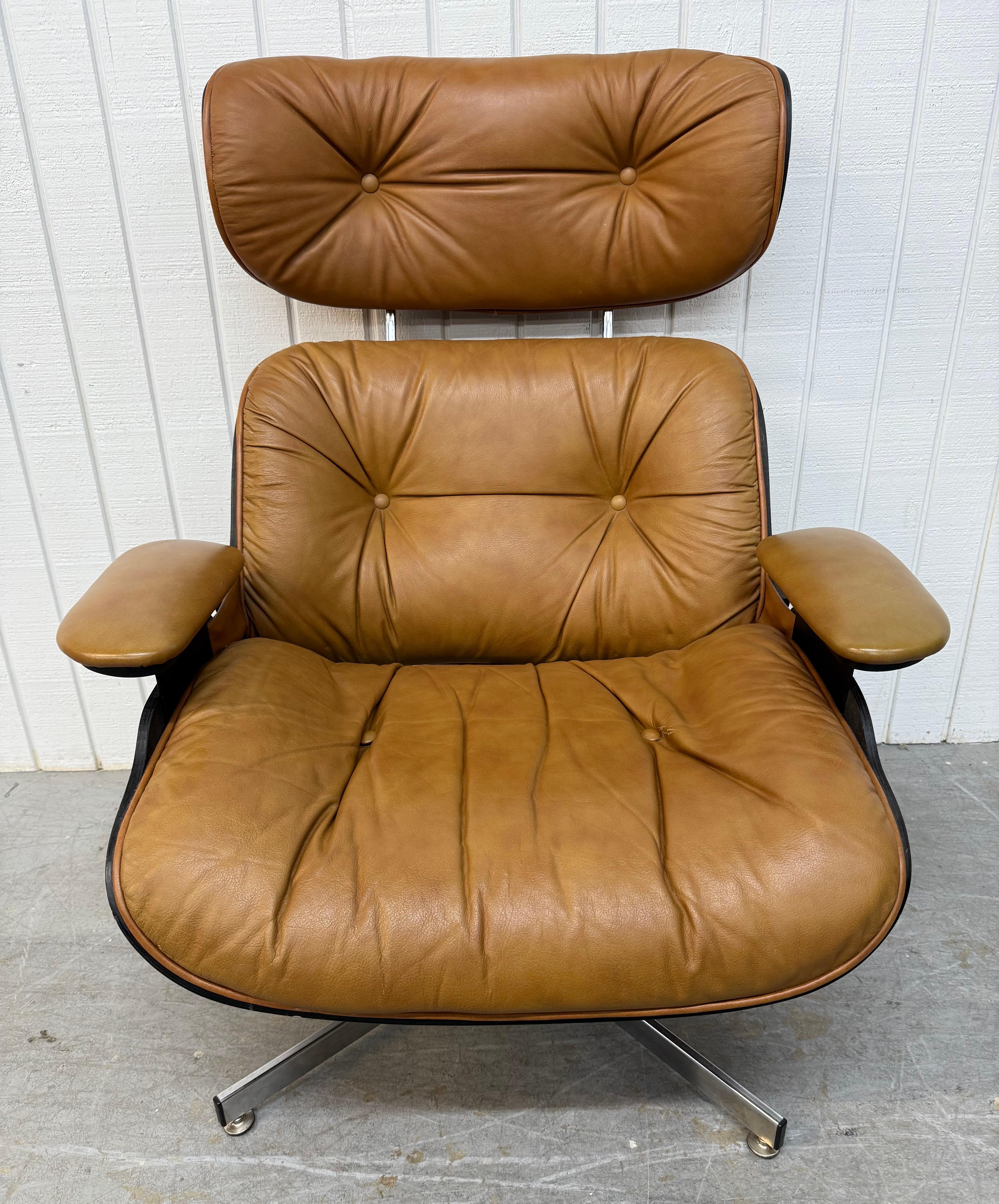 This listing is for a Mid-Century Modern Selig Leather Eames Lounge Chair & Ottoman. Featuring an Eames style design, tan leather upholstery,  walnut backside, chrome legs, and original tag. This is an exceptional combination of quality and MCM