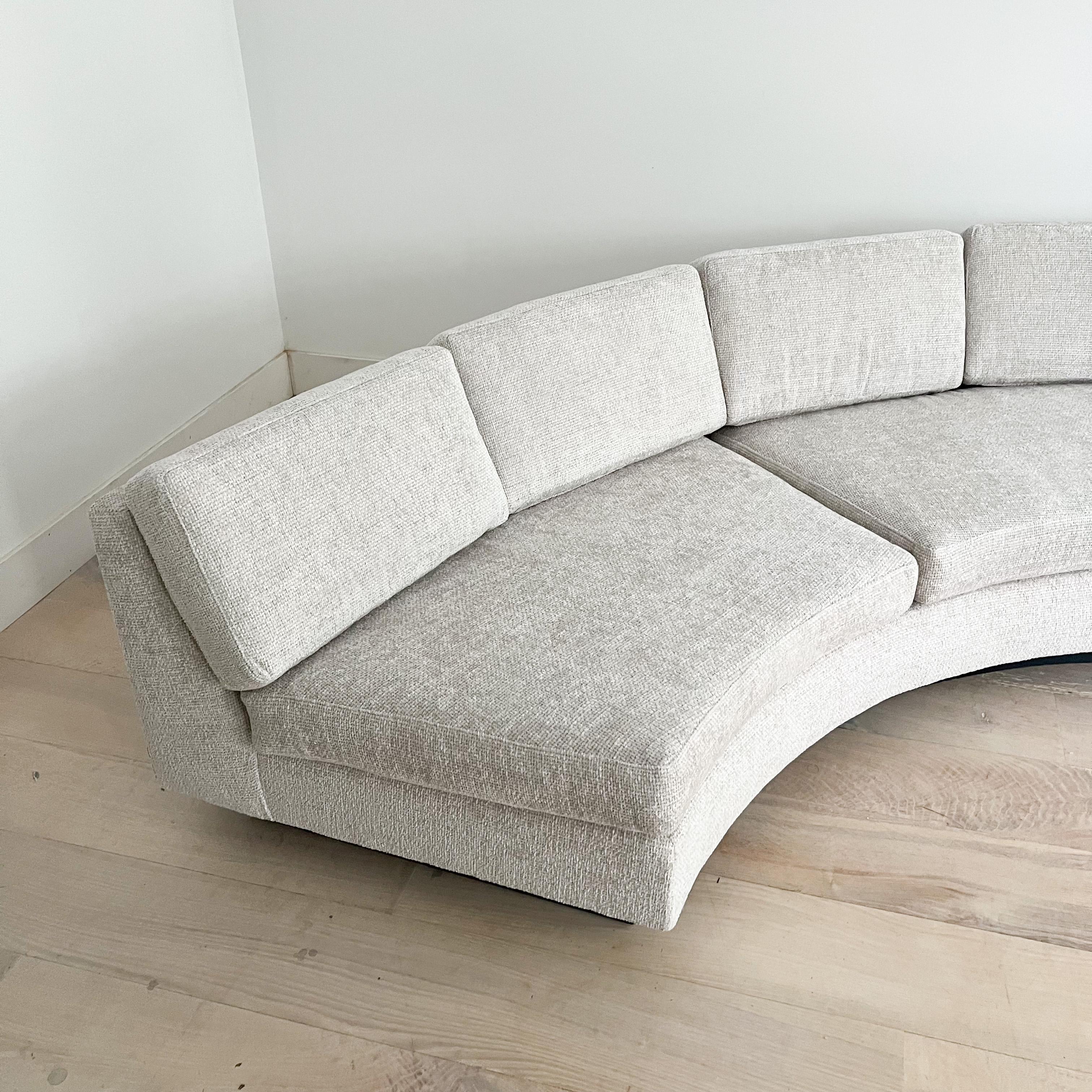 Elevate your interior with this exquisite mid-century modern two-part semi-circle sectional sofa. Meticulously restored, this statement piece boasts a blend of form and function that will transform your living space.

Featuring brand-new foam