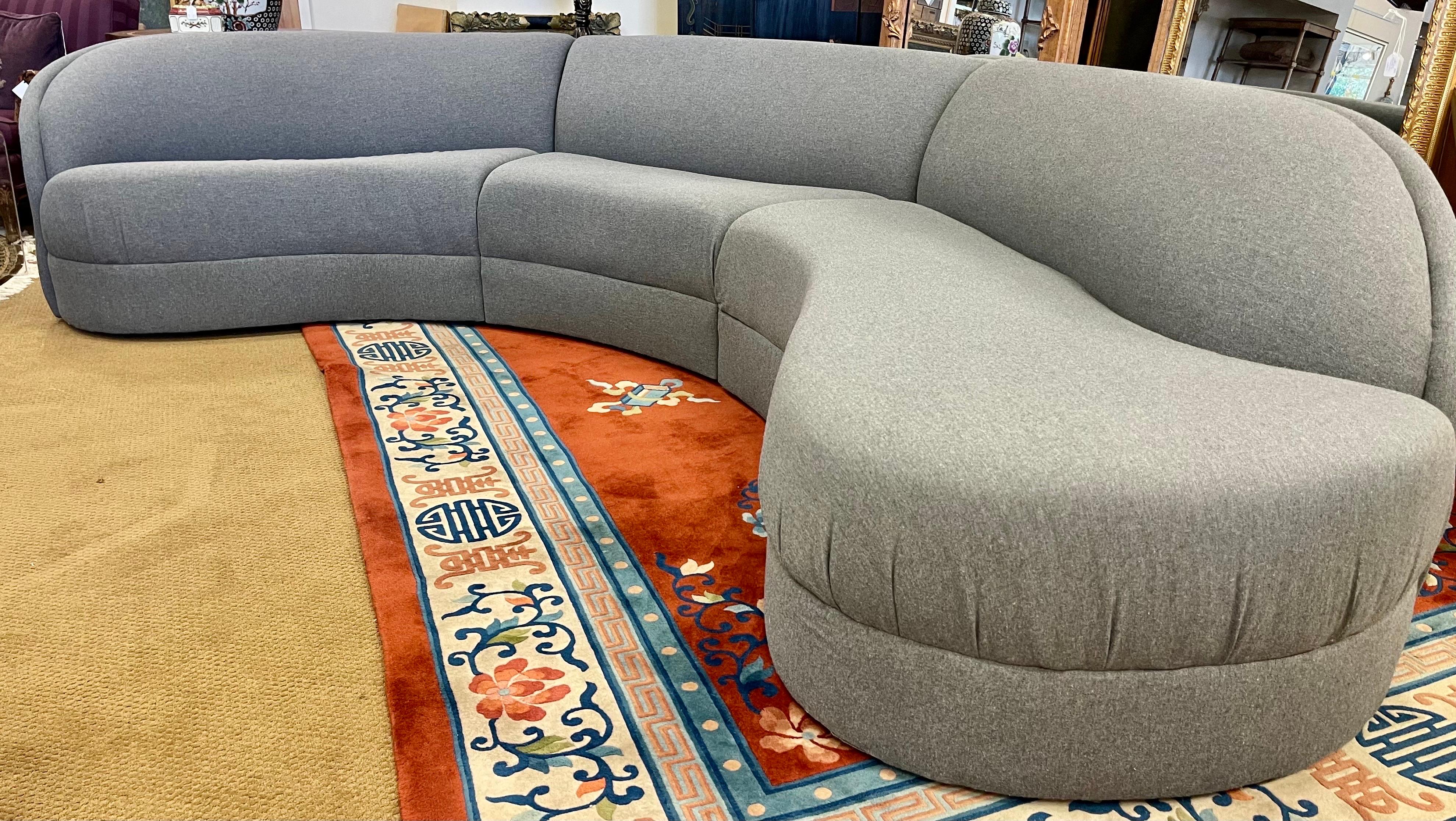 Magnificent Mid-Century Modern cloud sectional sofa. Biomorphic shape with great scale and lines to die for! Will be the most comfortable seating in your home. Fabric is a medium gray solid color and still in great condition. You can tell that this
