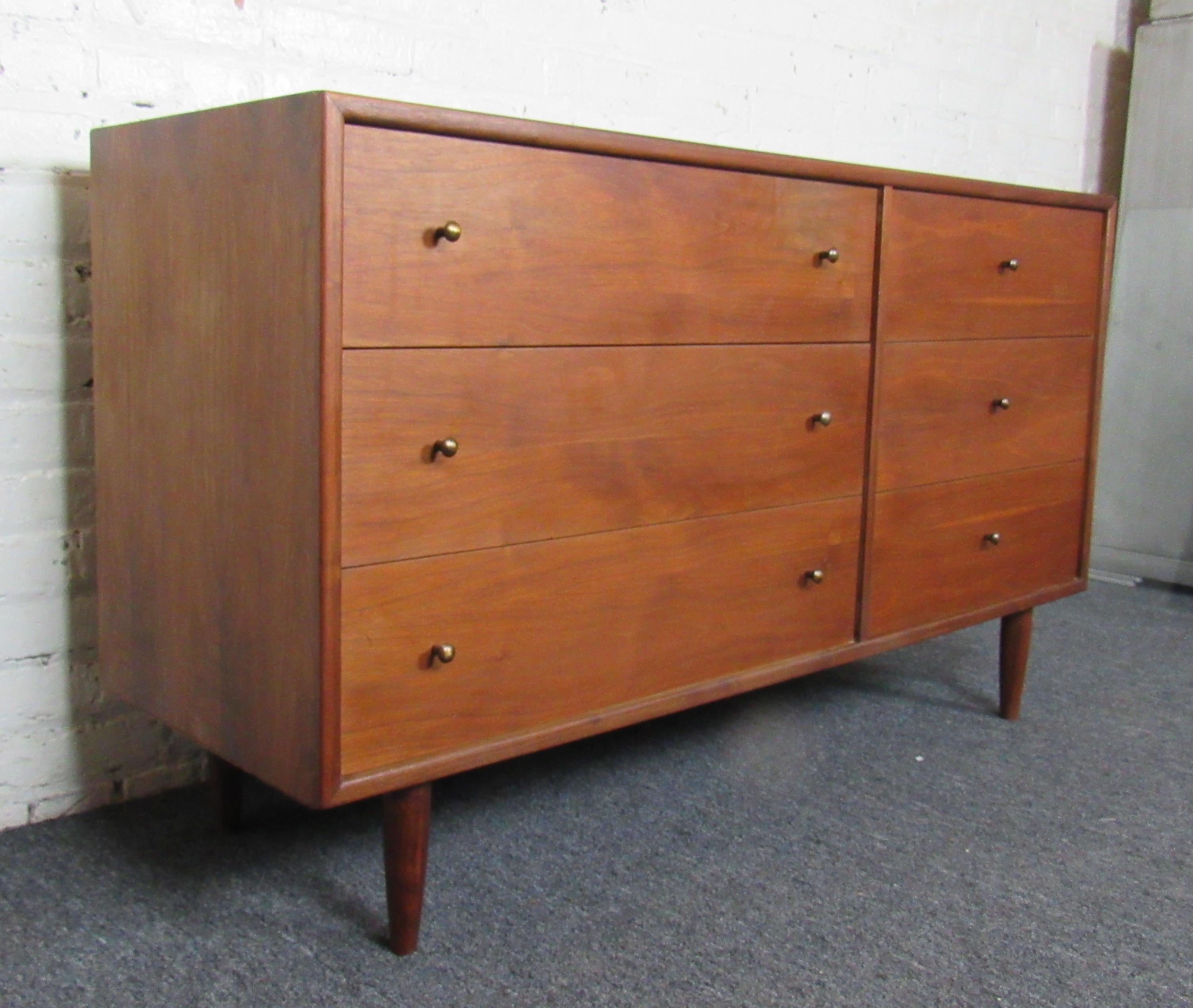 A classic and sturdy midcentury piece, this server features the rich colors of walnut wood and six drawers with brass knobs. 
Please confirm the item location with the dealer. (NJ/NY).