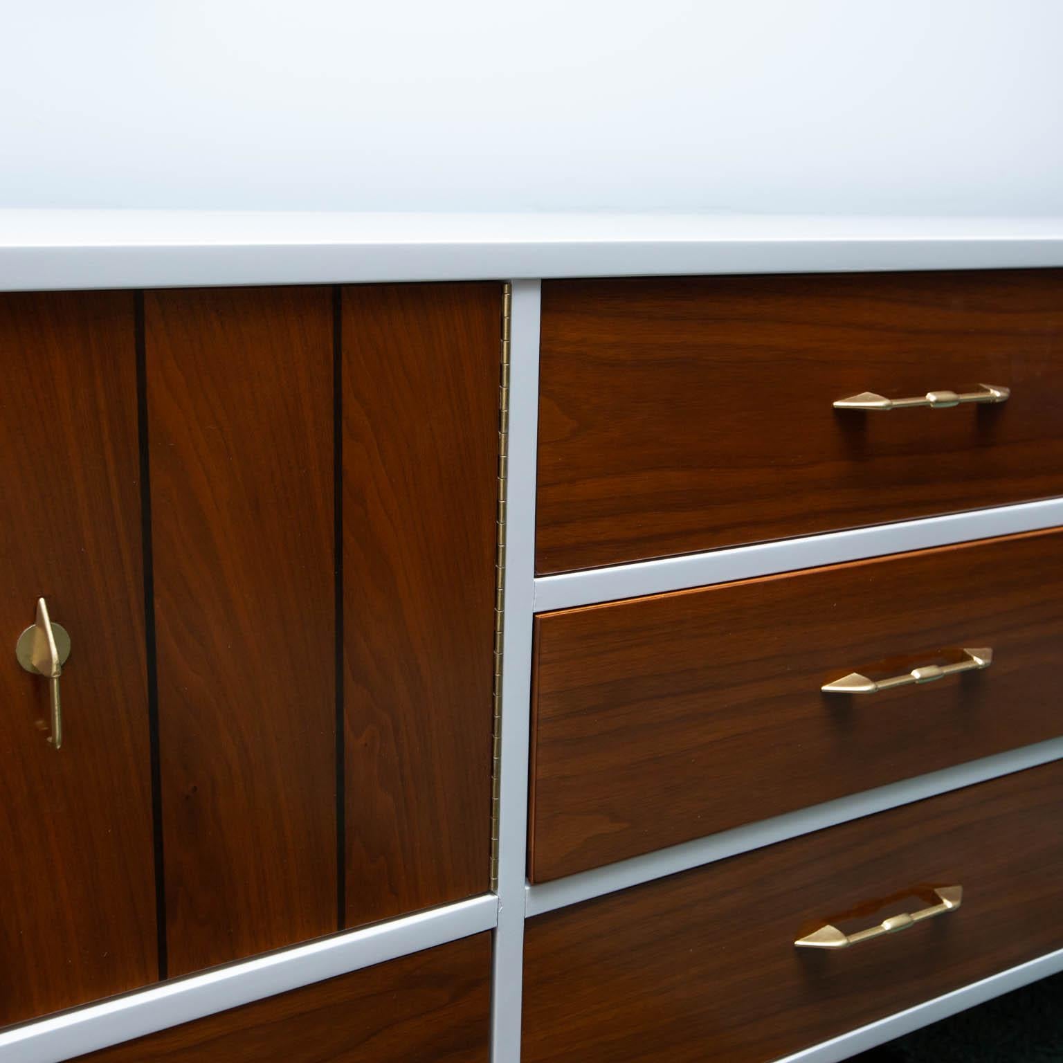 Clean sideboard-server freshly wrapped in white dove lacquer with more than ample storage. Great light walnut veneers.