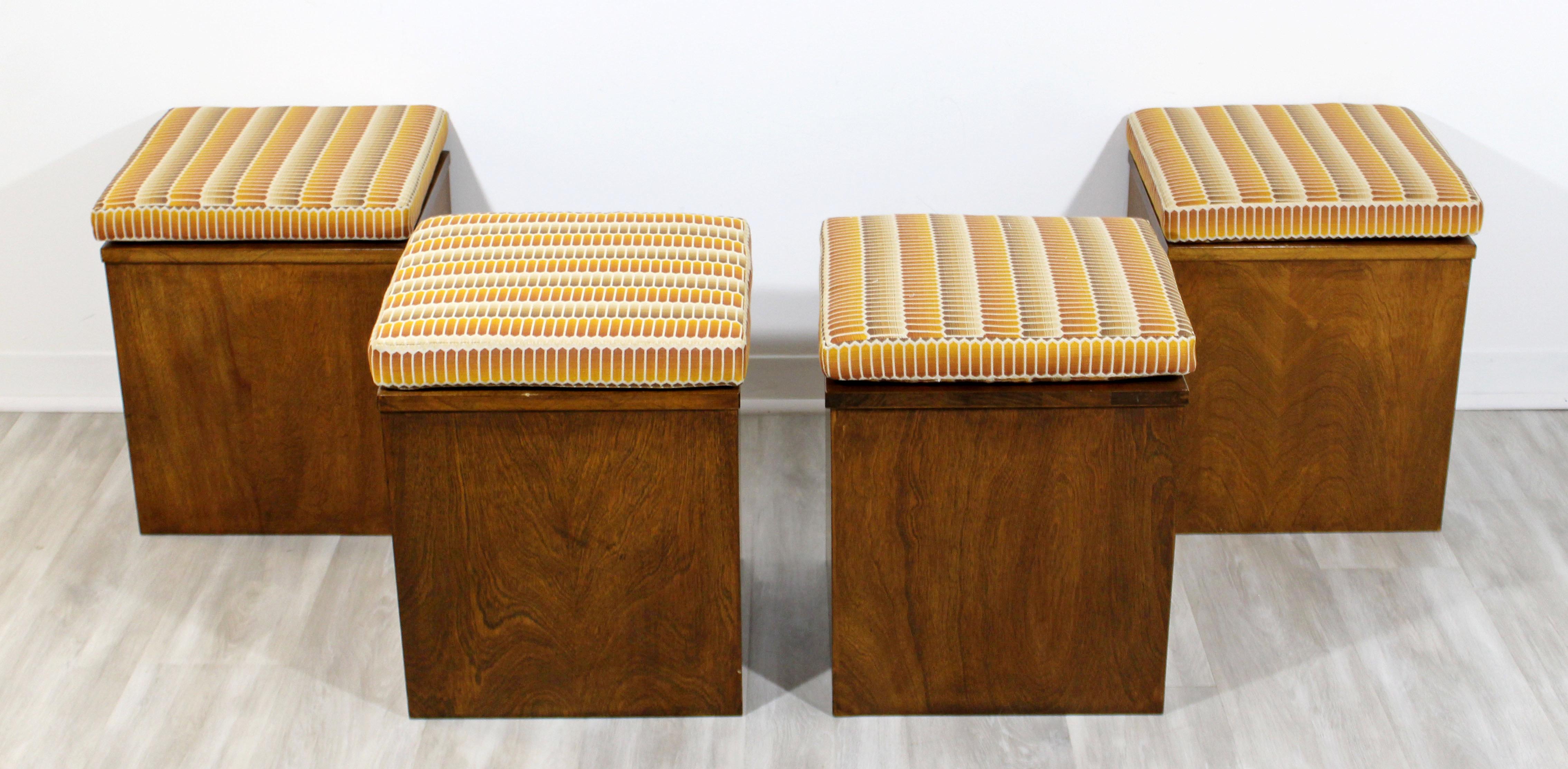 For your consideration is a gorgeous set of four, cube stools or ottomans, made of walnut and with orange patterned cushions, circa 1960s. In very good vintage condition. The dimensions are 16
