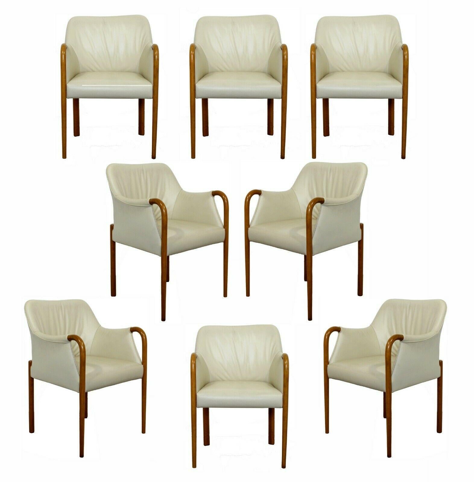For your consideration is a brilliant set of eight, beige leather and blonde wood, 