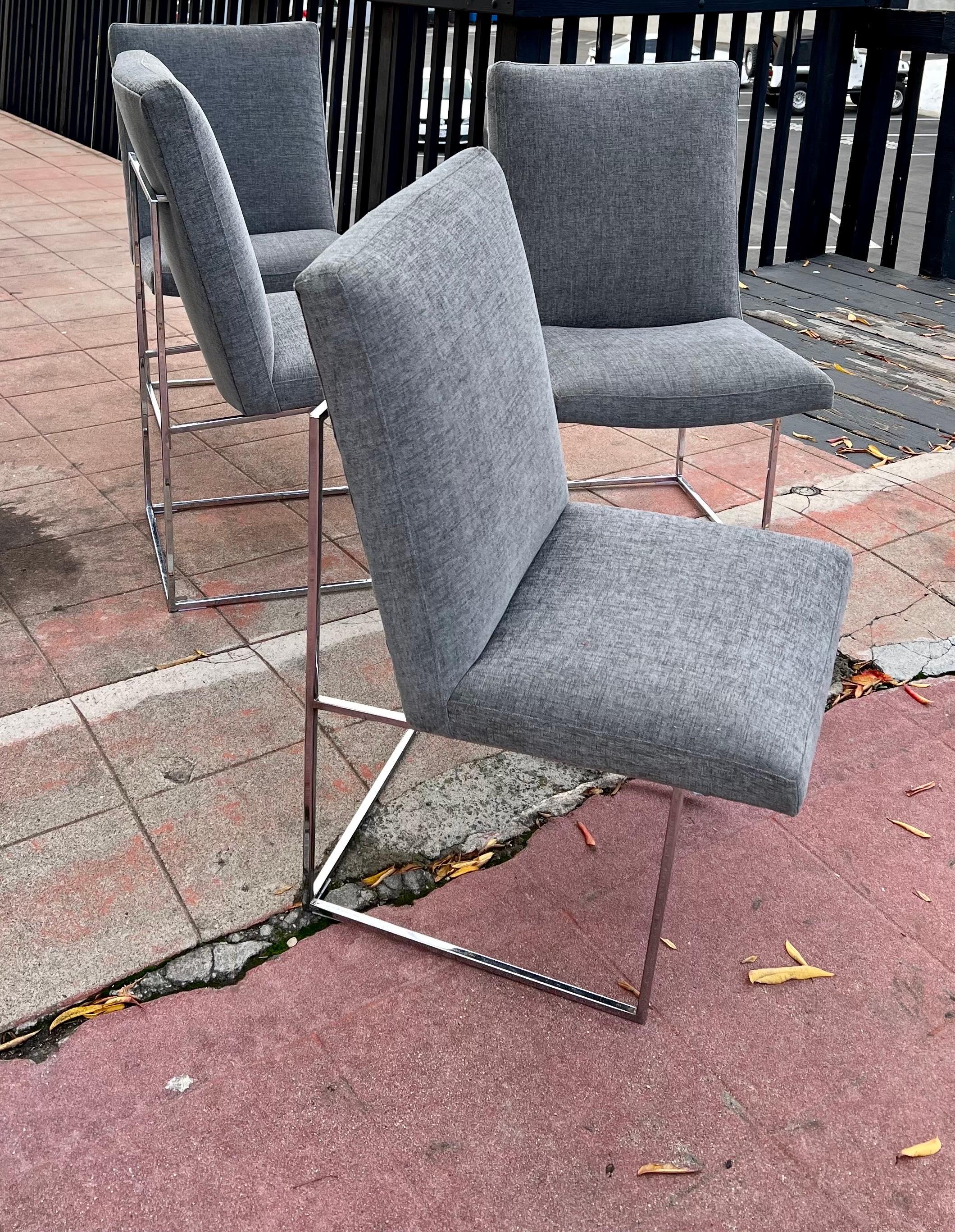 Great set of 4 dining chairs designed by Milo Baughman with chrome bases, The chairs have a polished chrome base. the fabric is made by Knoll. we have put new upholstery on the set they look great.