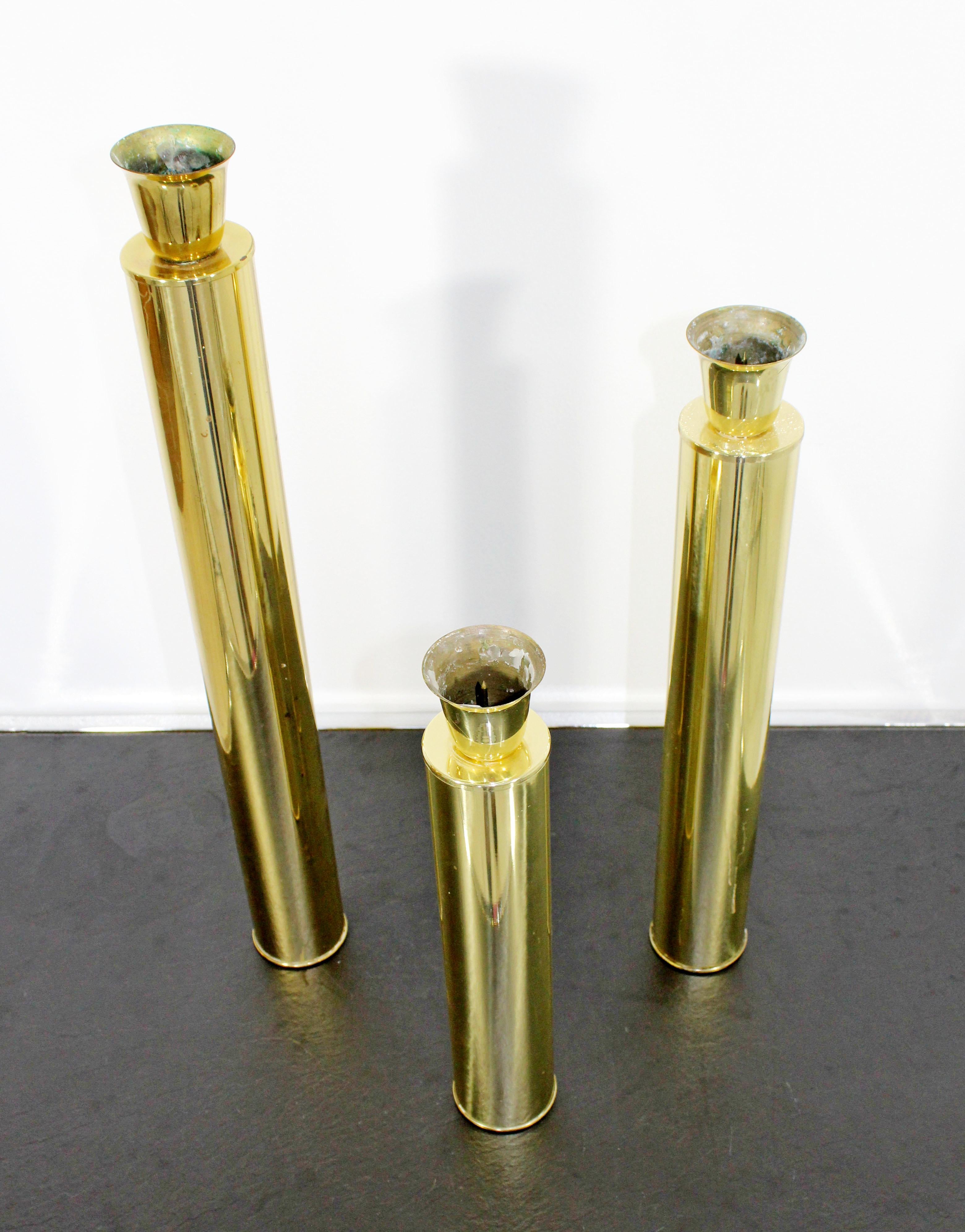 For your consideration is a magnificent, set of three, brass candle holders, by Oggetti, made in Italy, circa the 1970s. In excellent condition, with a natural patina to match piece's age and use. The dimensions of each are 2.5