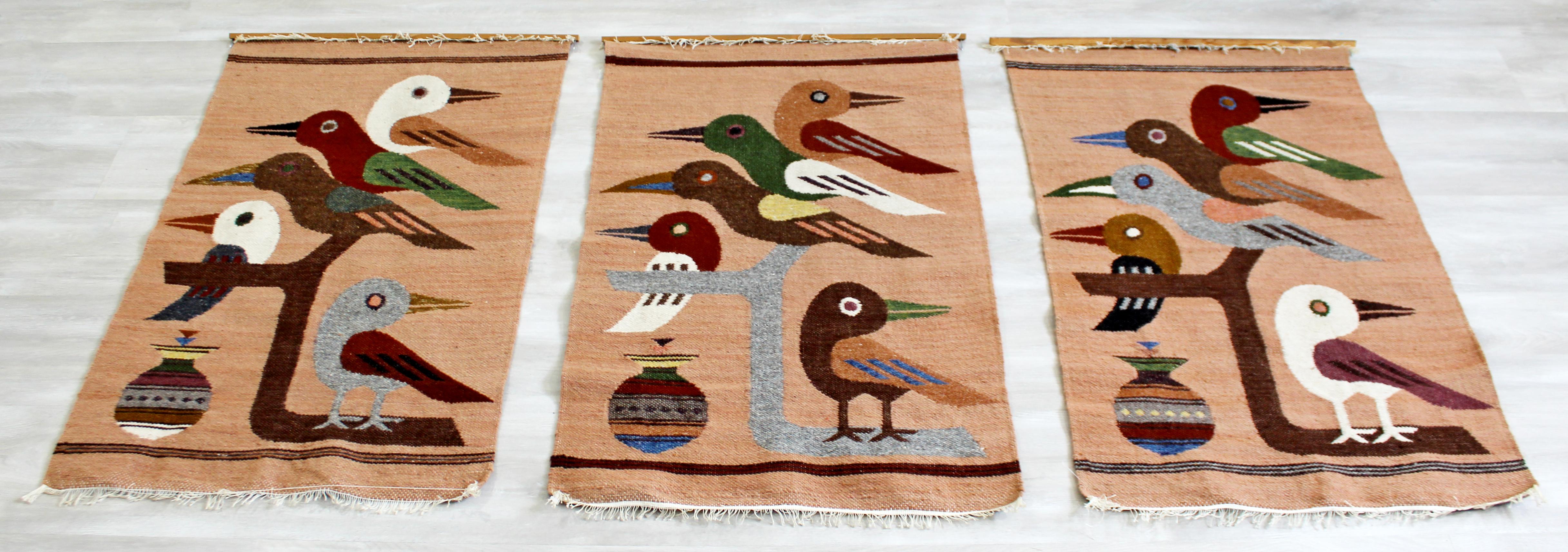 For your consideration is a gorgeous set of three, handwoven fiber wall art, depicting birds on branches, circa 1970s. In excellent vintage condition. The dimensions of each are 23
