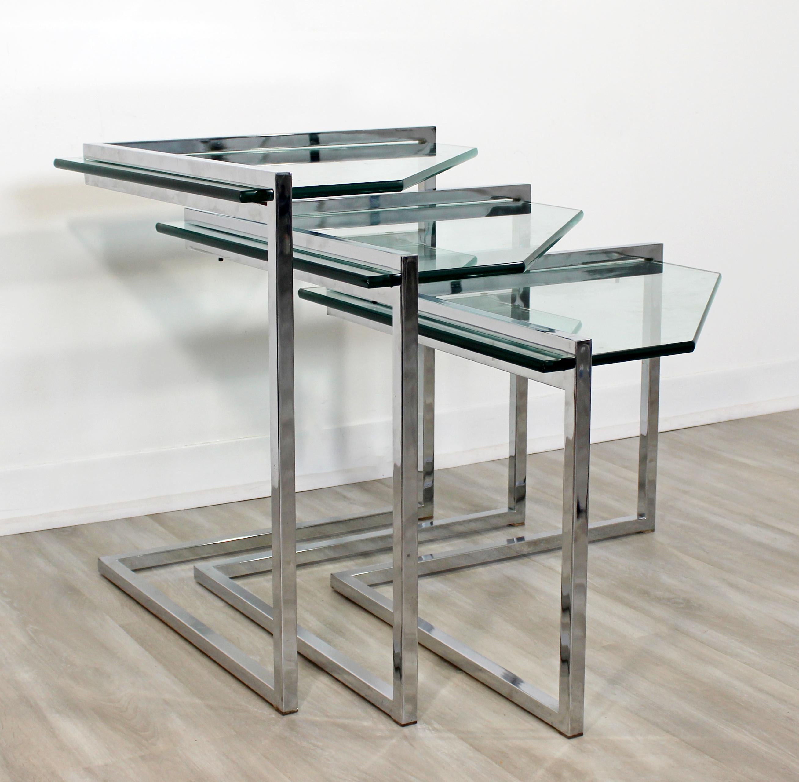 For your consideration is a fantastic set of three nesting tables, made of cantilever chrome and with glass inserts, circa the 1970s. In very good vintage condition. The dimensions of the three together are 28
