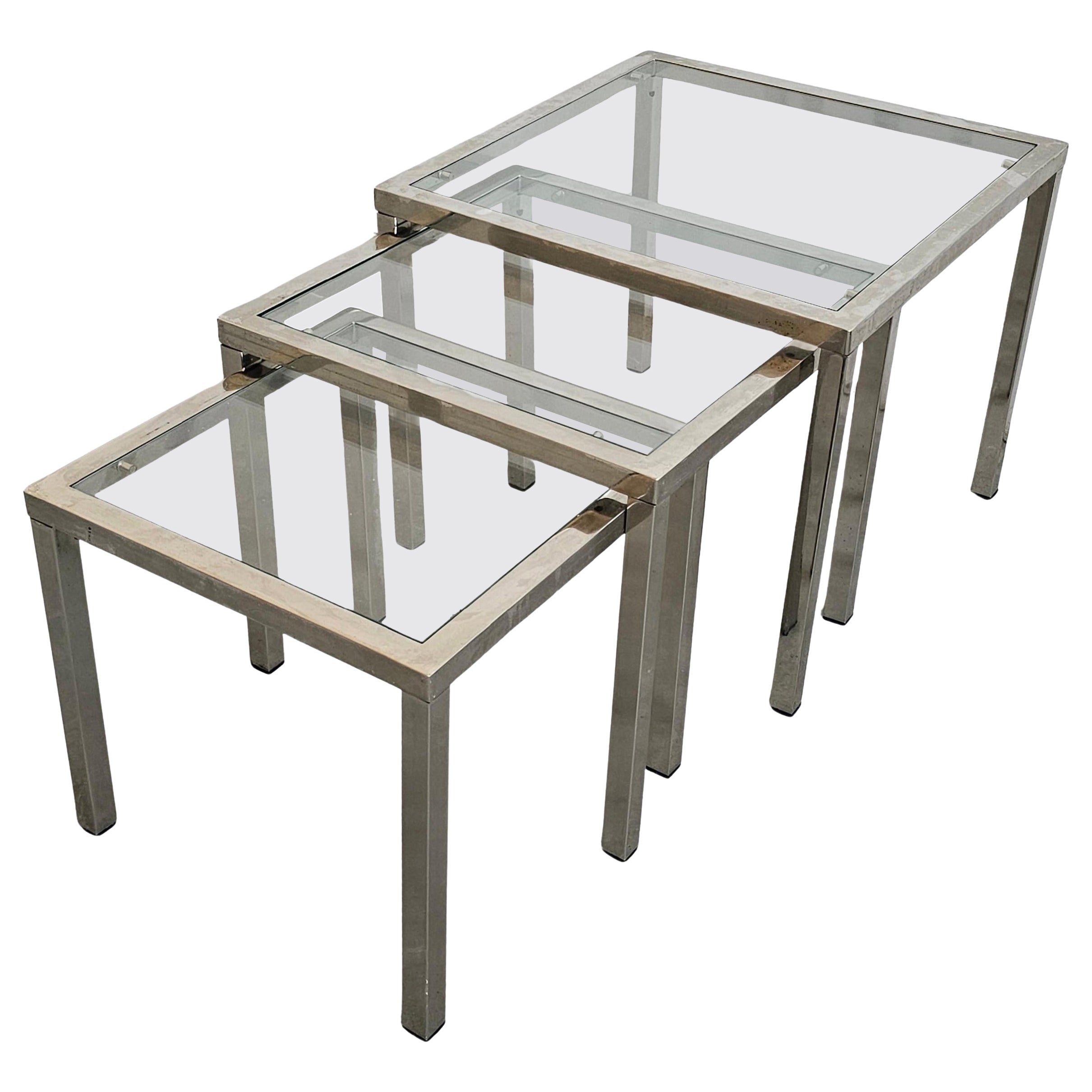 Mid Century Modern Set of 3 Nesting Tables done in Chrome with Glass Tops