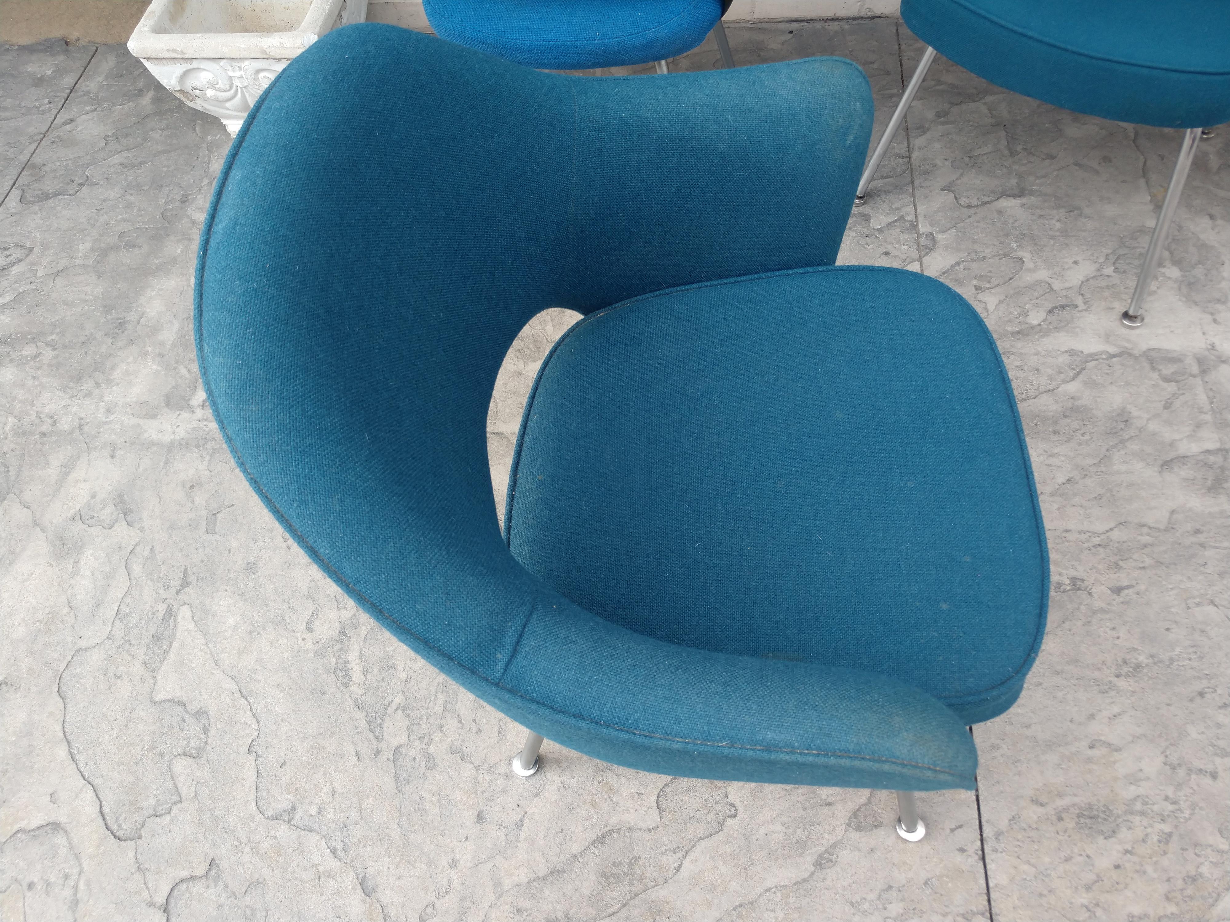 Set of 2 arm and 2 side executive chairs designed by Eero Saarinen for Knoll. Chairs came out of a IBM facility in upstate NY. Can be sold as pairs as opposed to a set of 4. Fabric is serviceable but could use an update. Dimensions for 2 side, non