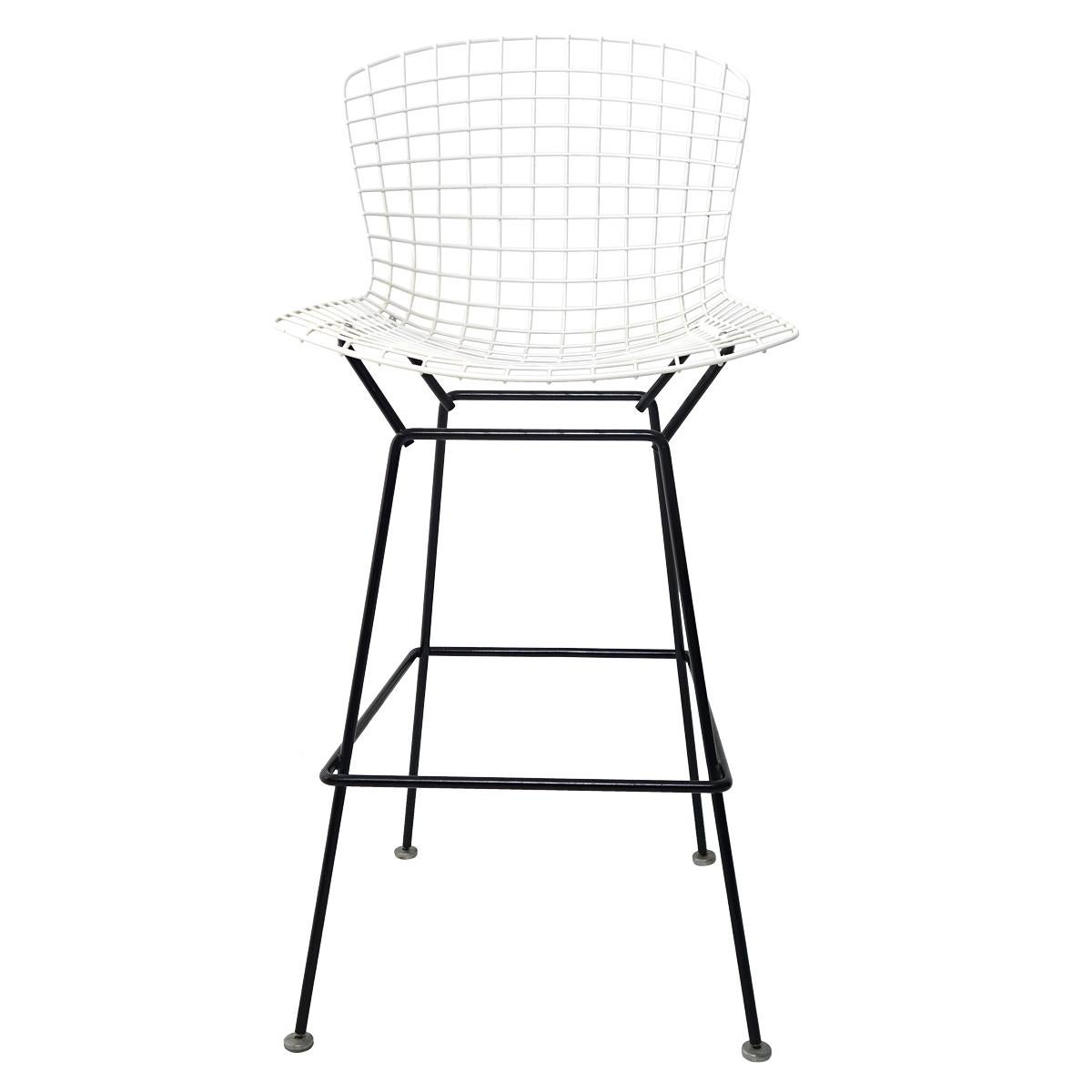 The wire bar stool by Harry Bertoia for Knoll International truly is a design icon.
This set of four has black metal bases with white metal seats. They were made in the United States in the 1970s.
  