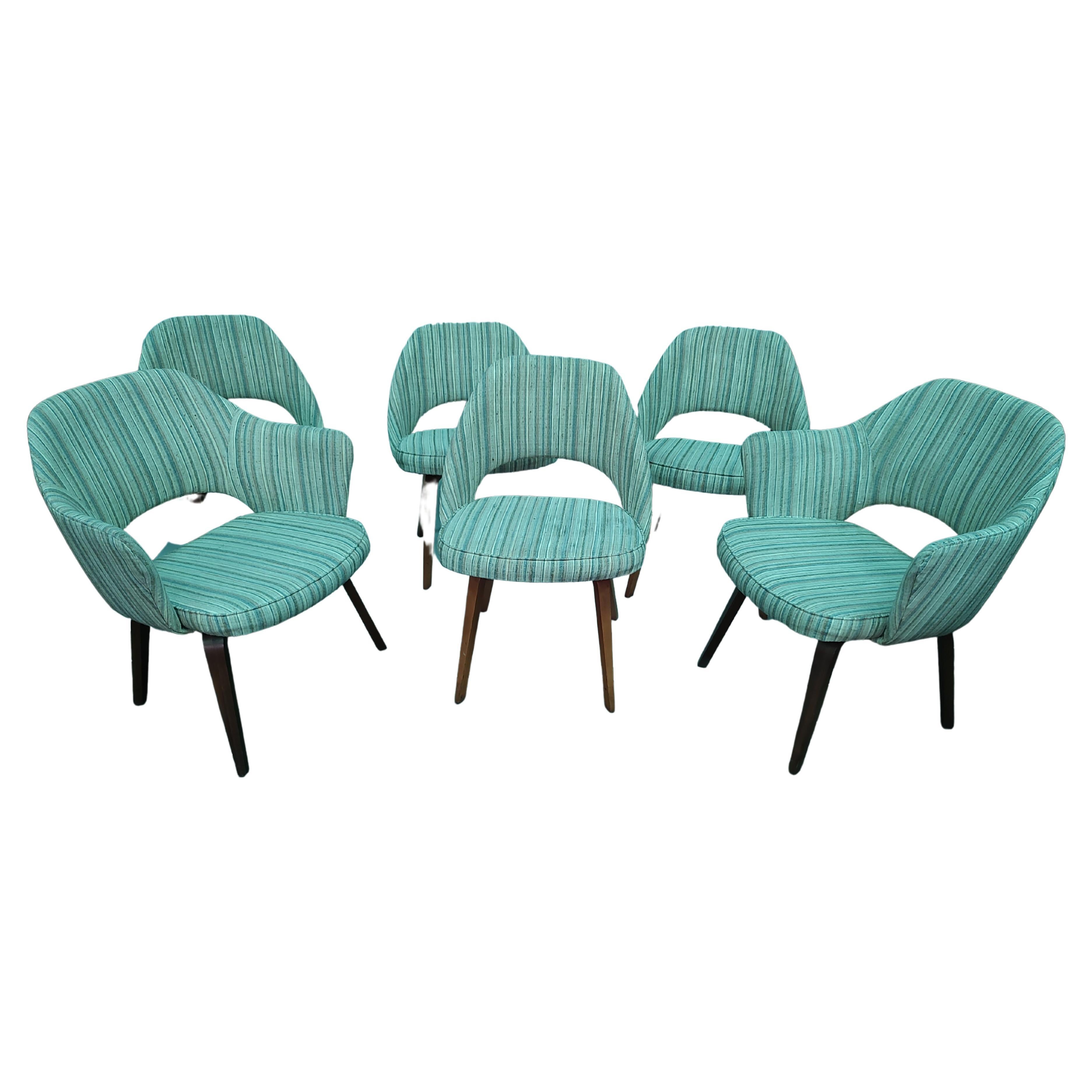 Fabulous set of six executive chairs by Eero Saarinen for Knoll industries with wooden legs. Please understand the photos have a green tint to them, nothing green about these chairs. Beautiful striped fabric, see the additional photos, a little SS