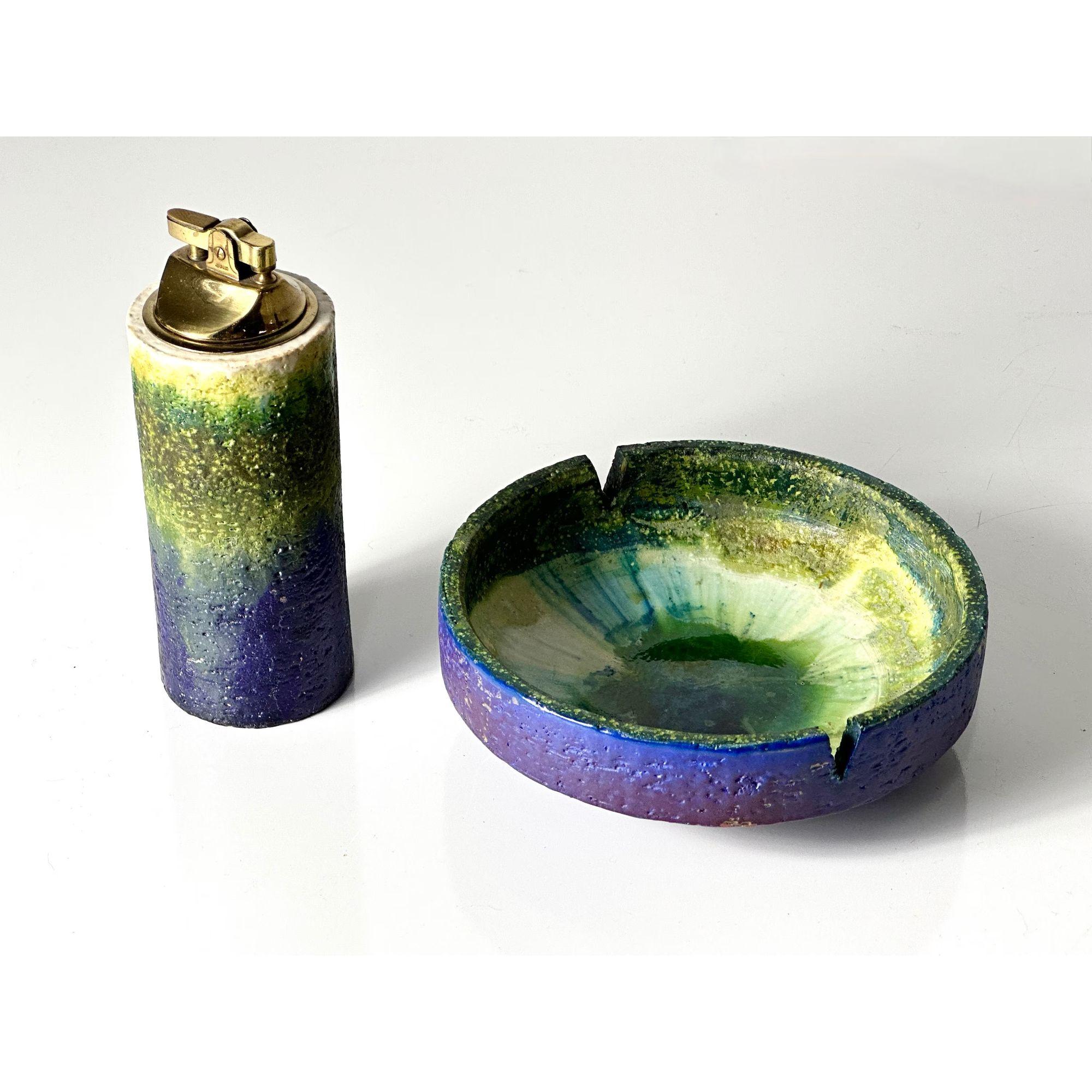 Vintage Marcello Fantoni for Raymor Ceramic Lighter and Ashtray Set Italian Pottery Mid Century Modern

Matching ashtray and table lighter set by Marcello Fantoni for Raymor circa 1950s
Glazed ceramic in phenomenal purple and green glaze
Both signed
