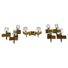 Vintage Mid-Century Modern set of eight brass and chrome sconces by Sciolari. Italy 1970
