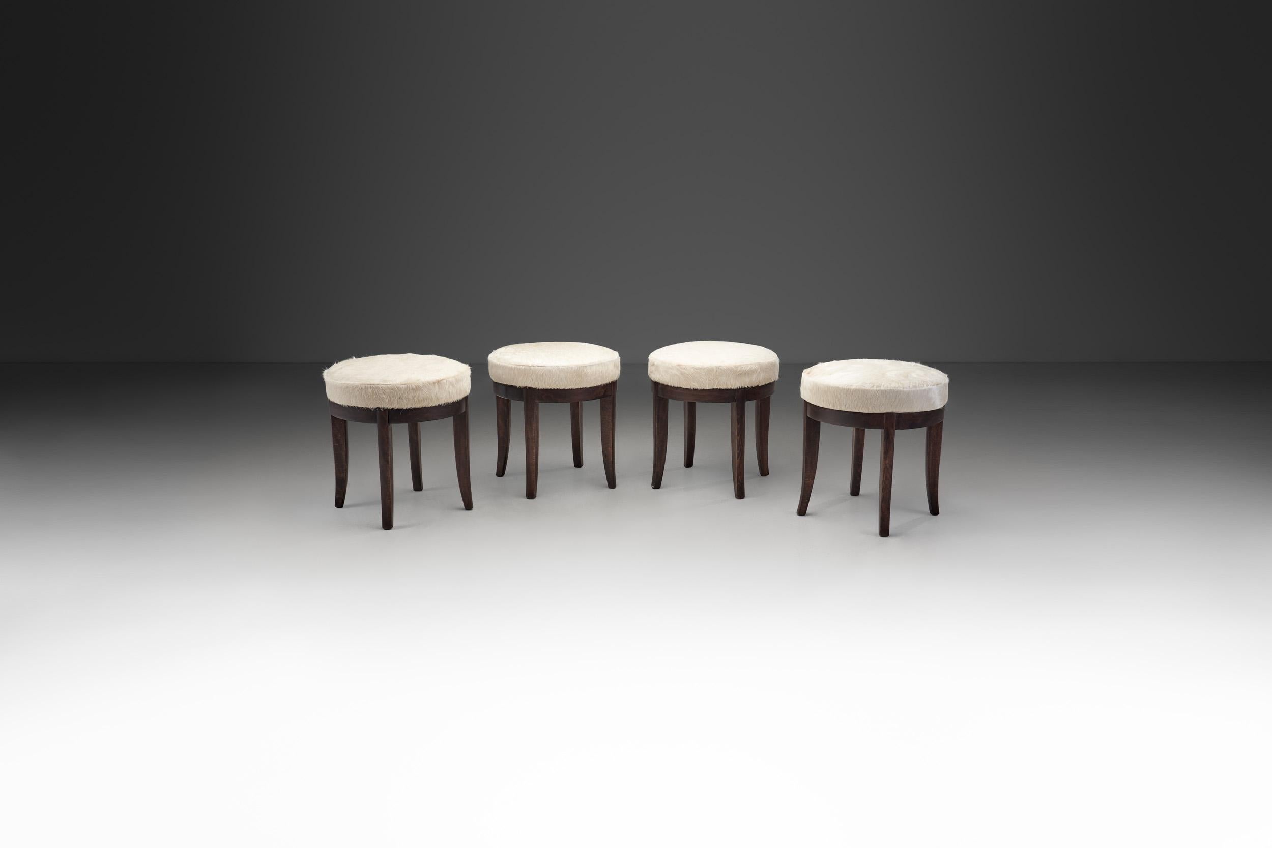 Mid-Century Modern Set of Four Stools in Cowhide, Europe, ca 1950s In Good Condition For Sale In Utrecht, NL
