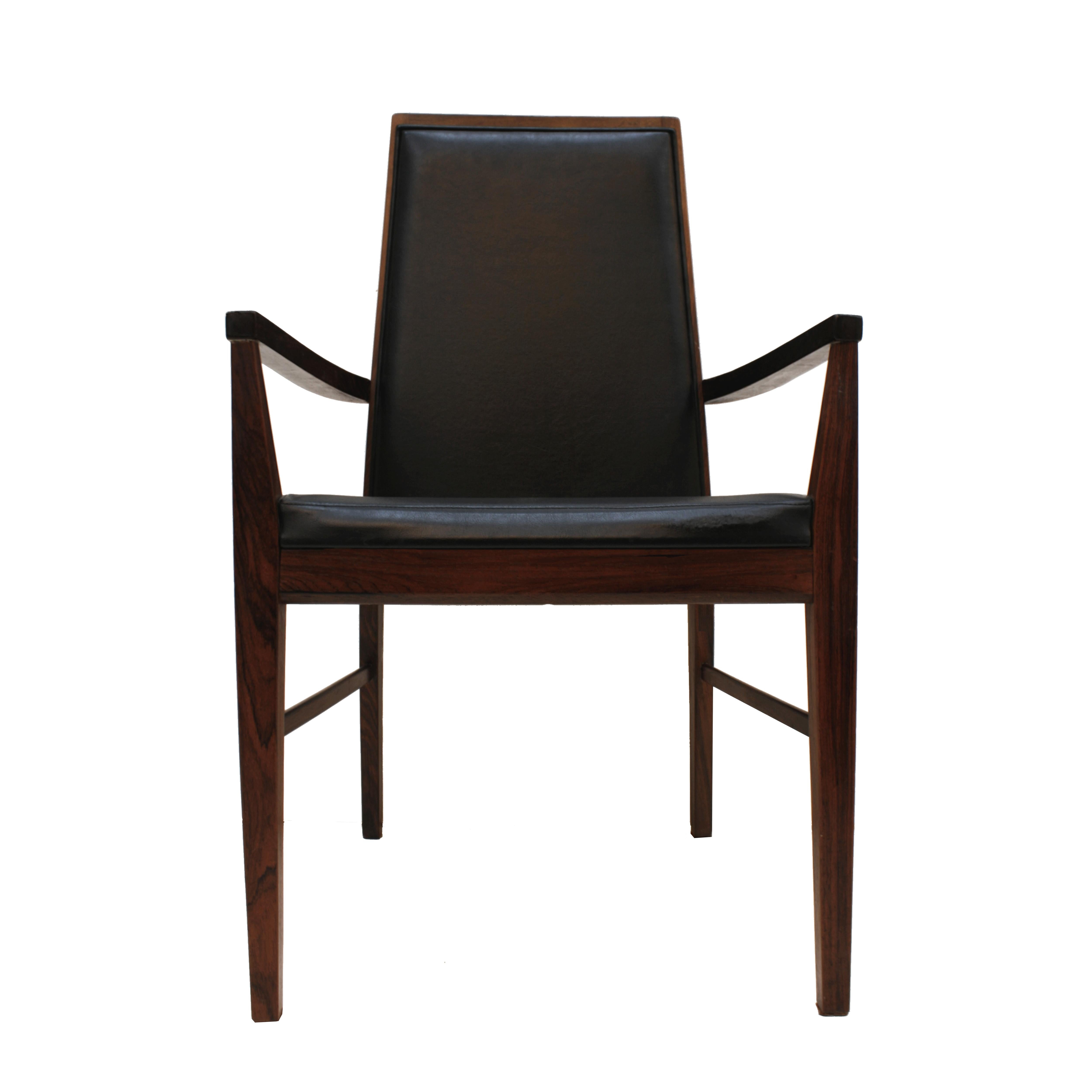 An elegant Mid-Century Modern set of six Danish dining chairs designed by Arne Vodder and edited by Dyrlund. Made of solid wood structure. Seat and back upholstered in its original black vinyl leather, Denmark, 1960s.

Our main target is customer