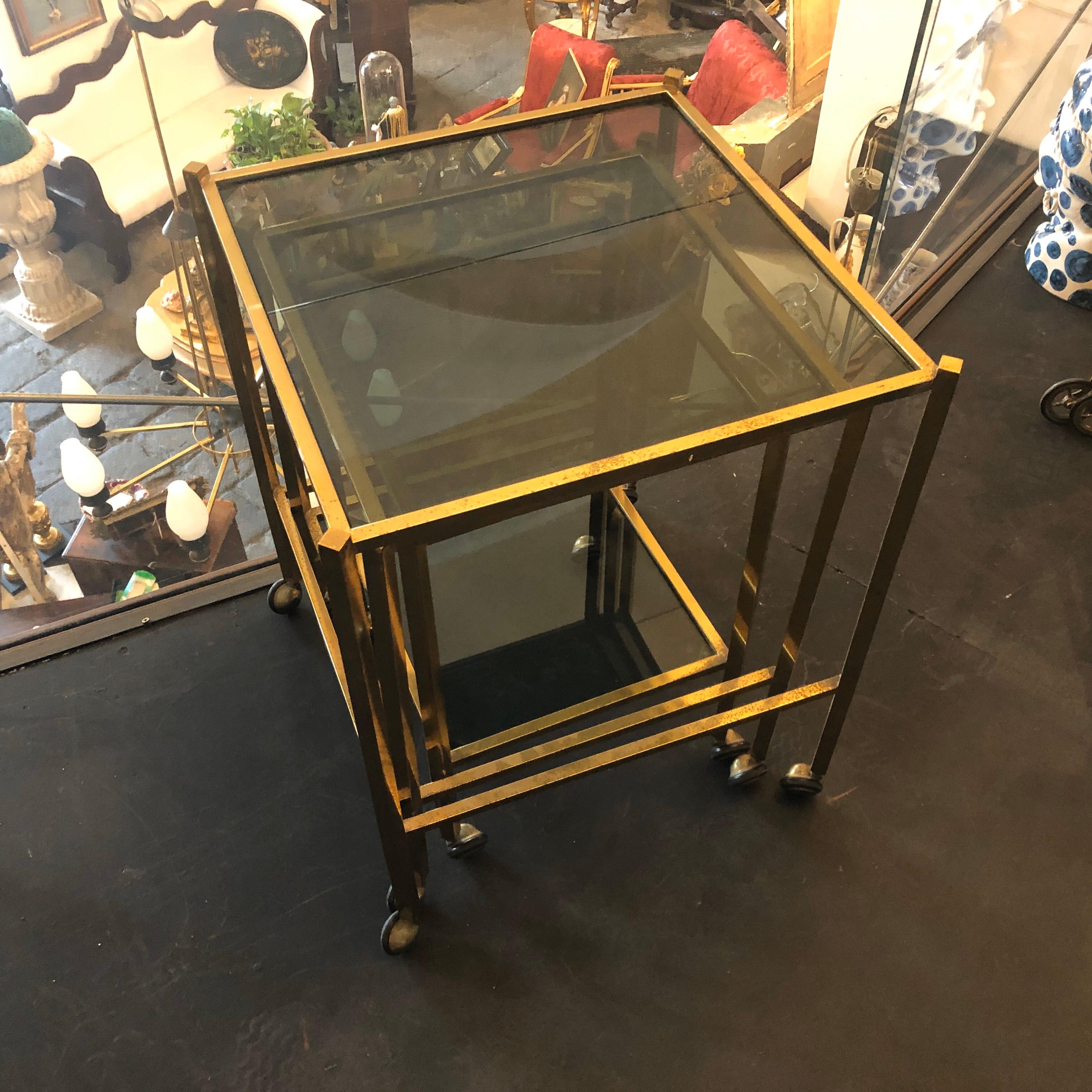 Mid-Century Modern Set of Three Brass and Smoked Glass Nesting Tables circa 1960 In Good Condition In Aci Castello, IT