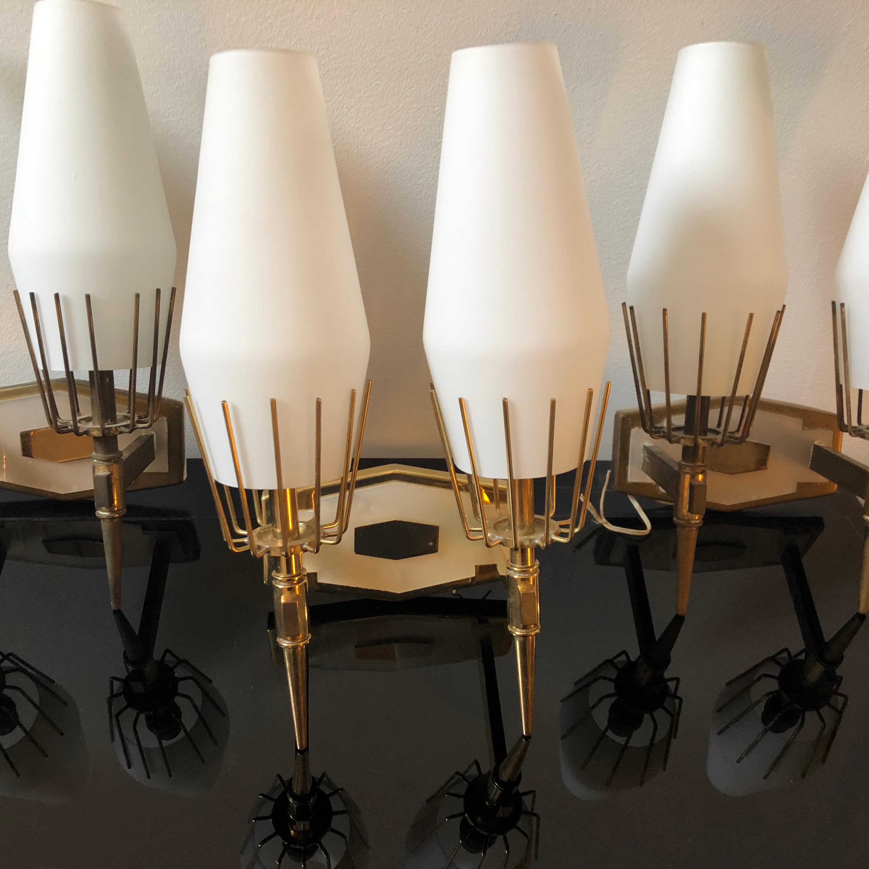 Three Mid-Century Modern wall sconces made in Italy in the 1950s, brass and white glass in perfect conditions, they have also in the front a plastic part with a faux white marble effect. As you can see in the pic, one of them has been perfectly
