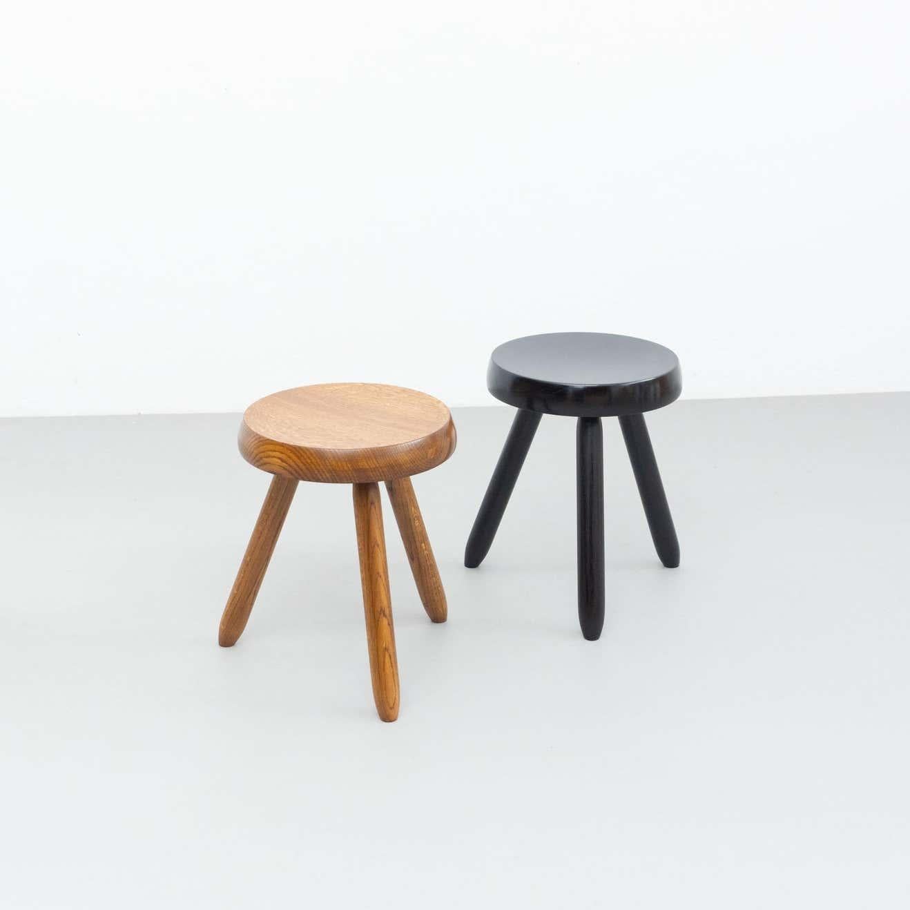 Stools designed in the style of Charlotte Perriand.
Made by unknown manufacturer.

In good original condition, preserving a beautiful patina, with minor wear consistent with age and use. 

Materials:
Wood

Dimensions:
30 D cm x 30 W cm x 40
