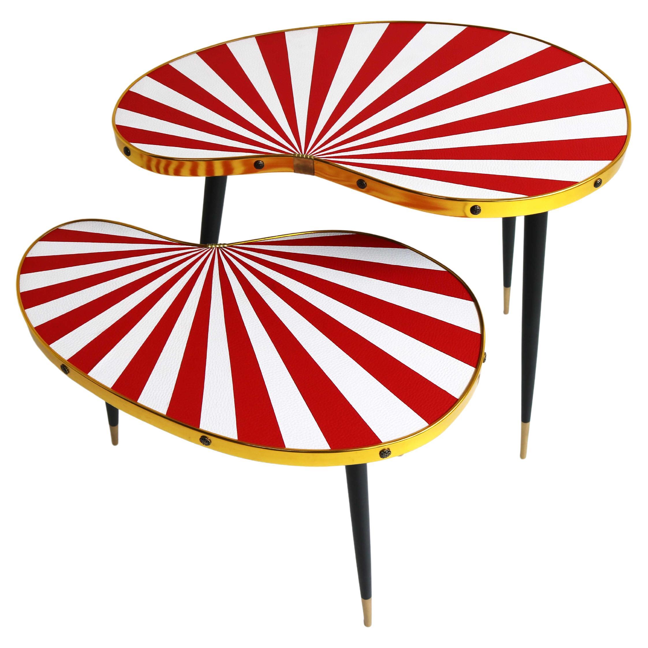 Pair Vintage side tables, set of plant tables 1950-1974

Couple of striking striped occasional tables.
German plants table set with red rays of sunlight.
Two Kidney shaped side tables, with elegant slender legs that gives the tables its