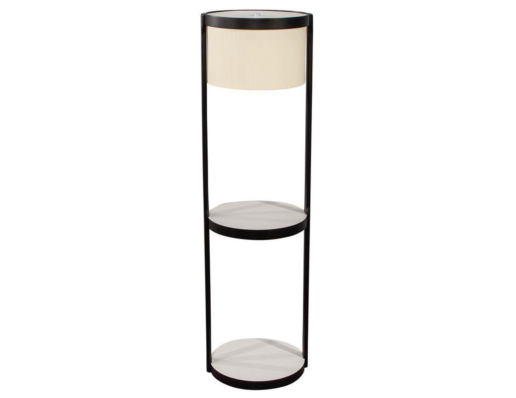 Mid-Century Modern shelf floor lamp. White shelf accents with unique finned shade.

Price includes complimentary curb side delivery to the continental USA.