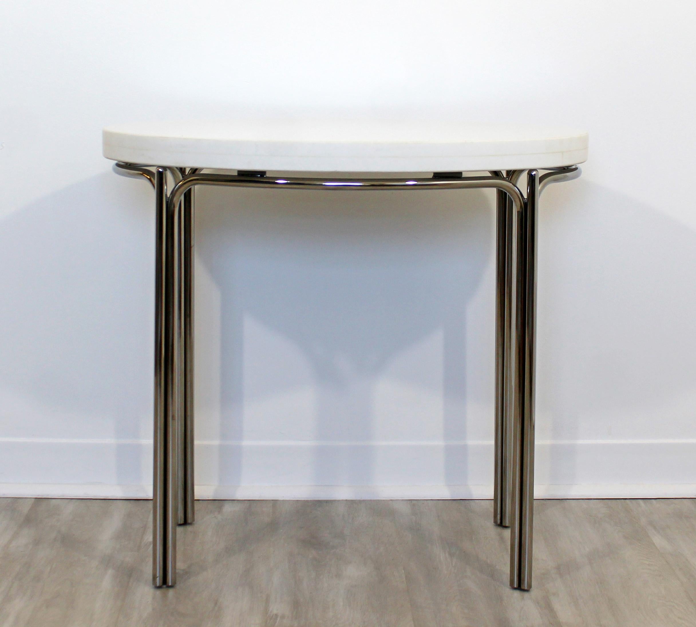 For your consideration is a simple and stunning chrome and marble side, end or accent table, circa 1970s. In excellent vintage condition. The dimensions are 27