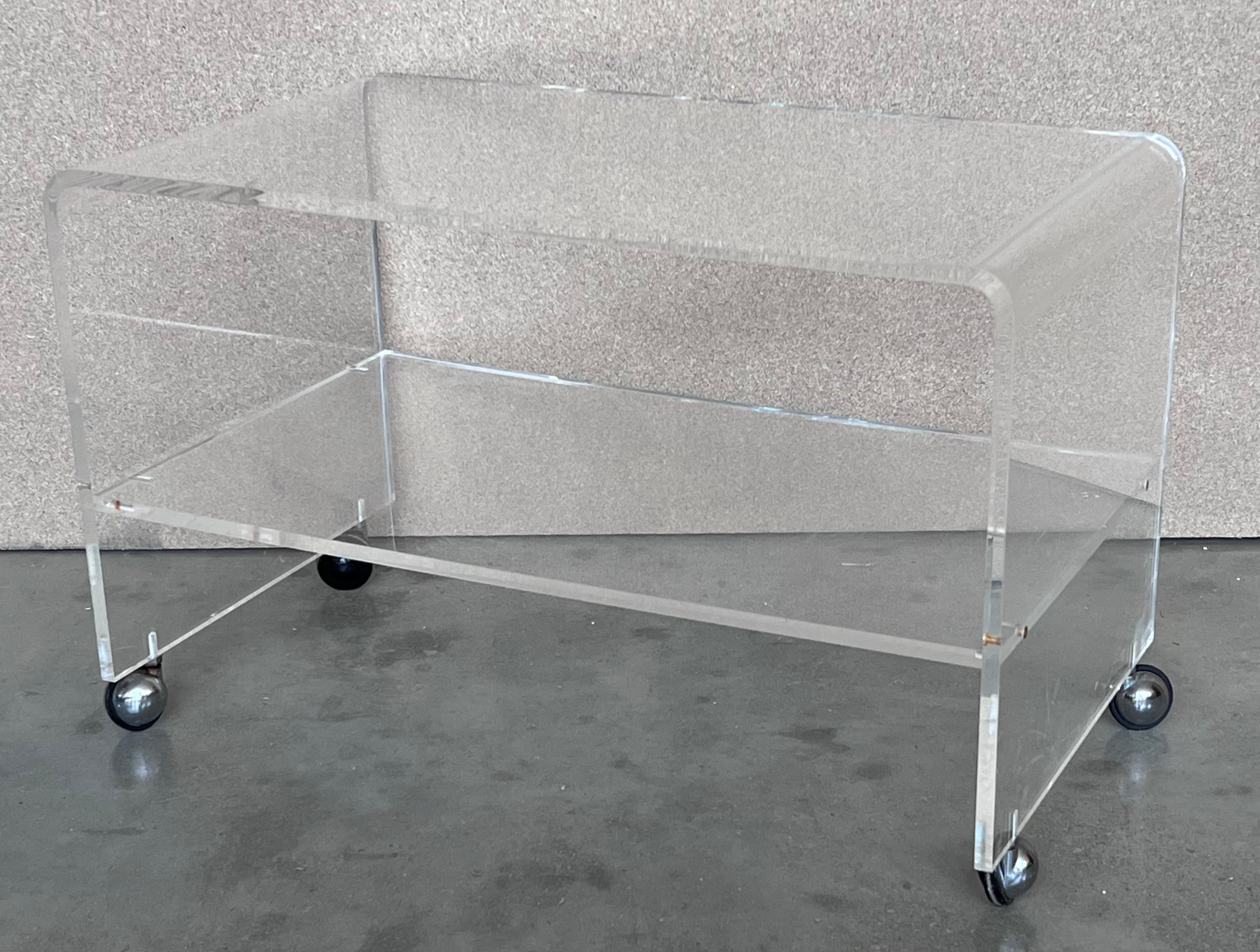Lucite Mid-Century Modern Side or Center Table with Two Tiewr and Wheels, France, 1970s For Sale