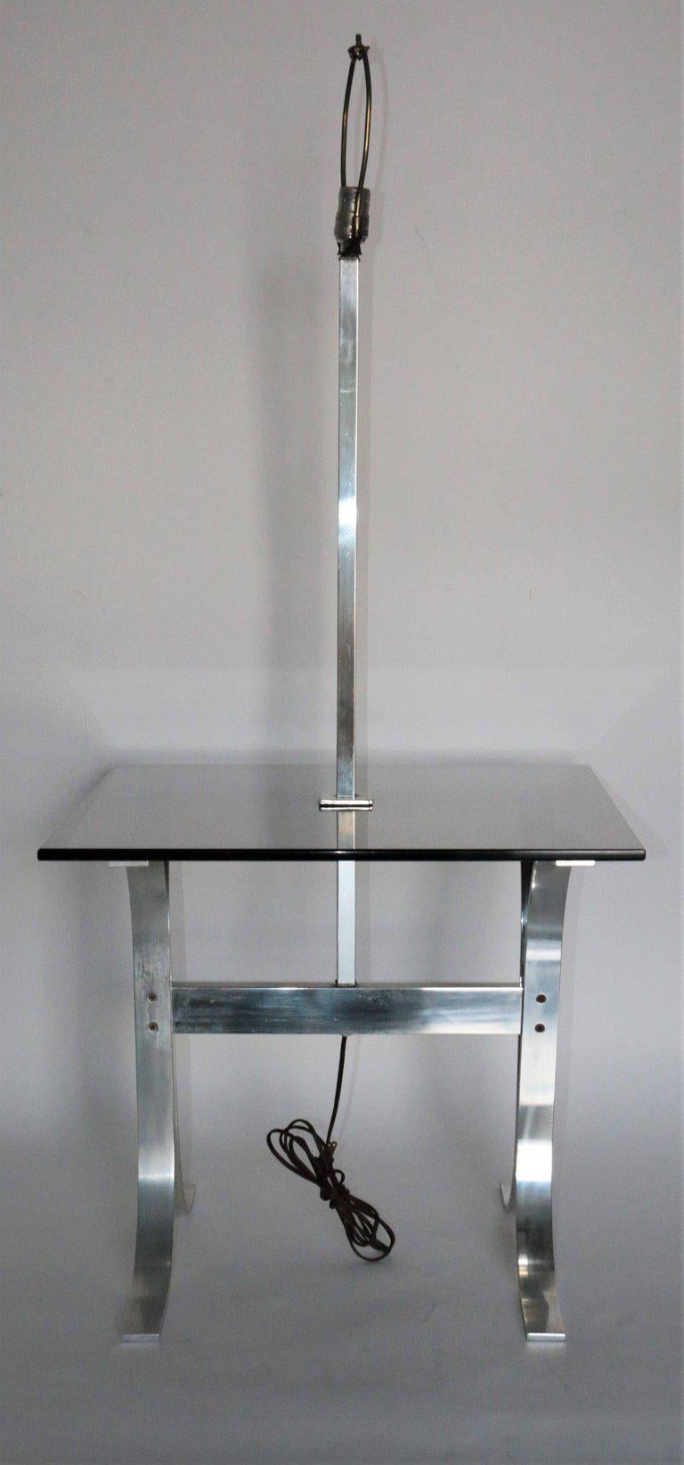 Description
Mid-Century Modern side table with a built in lamp and tinted glass. Made of chrome.
IN THE STYLE OF
Mid-Century Modern
PLACE OF ORIGIN
Denmark
DATE OF MANUFACTURE
1950
PERIOD
Mid-20th century
MATERIALS AND