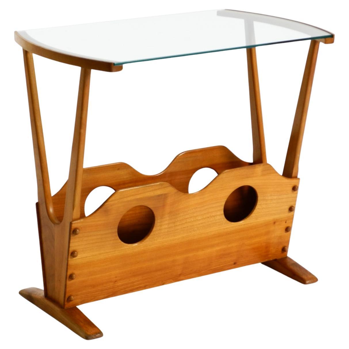 Mid-century modern side table with magazine rack, made of ash wood and glass For Sale