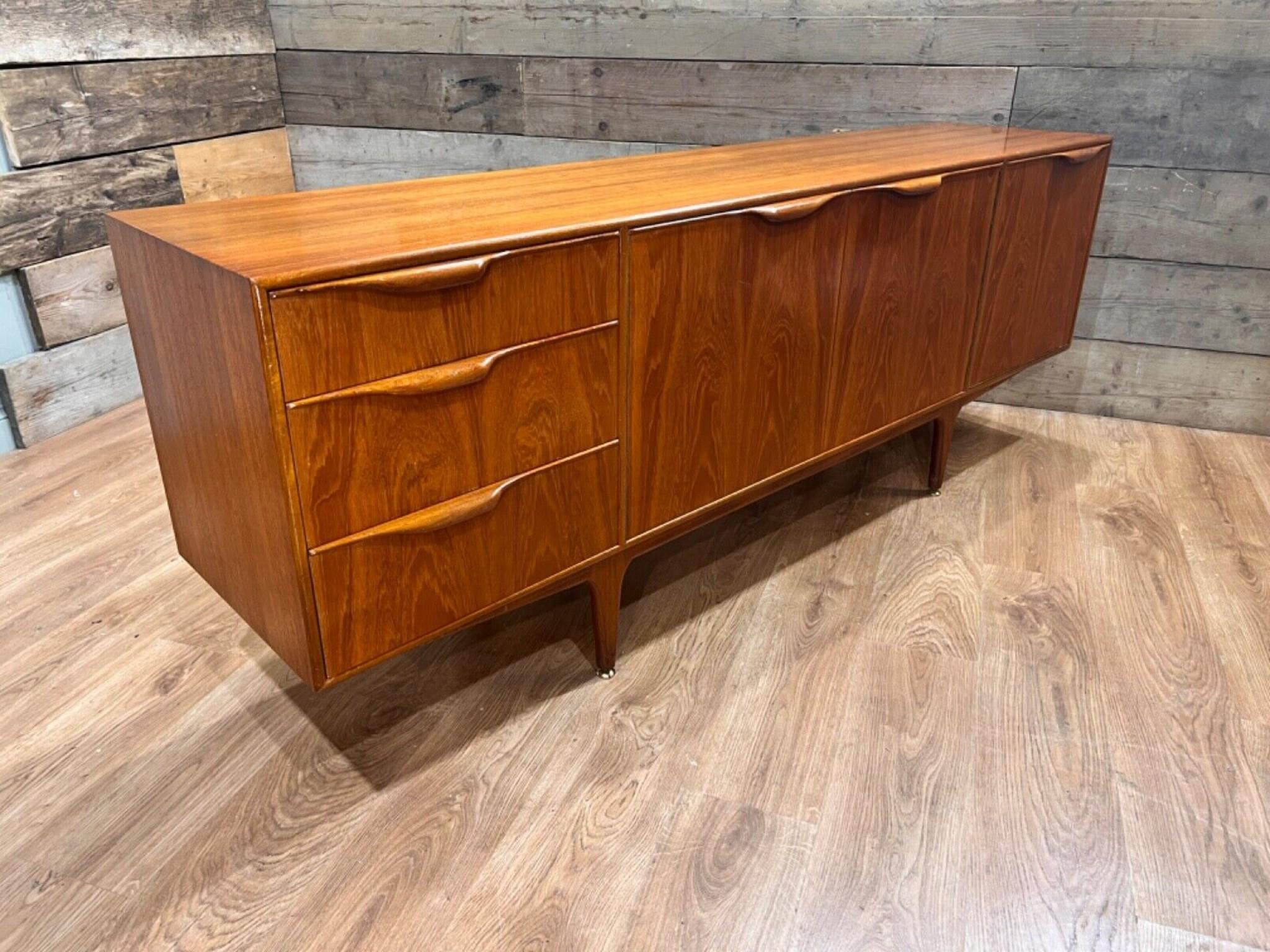 On trend 1960s Mid Century sideboard by AH McIntosh in the Danish style
Hand crafted from teak with a clean and minimal design
Opens out to reveal a lot of storage - three drawers, side hutch and central section
Offered in great shape ready for home