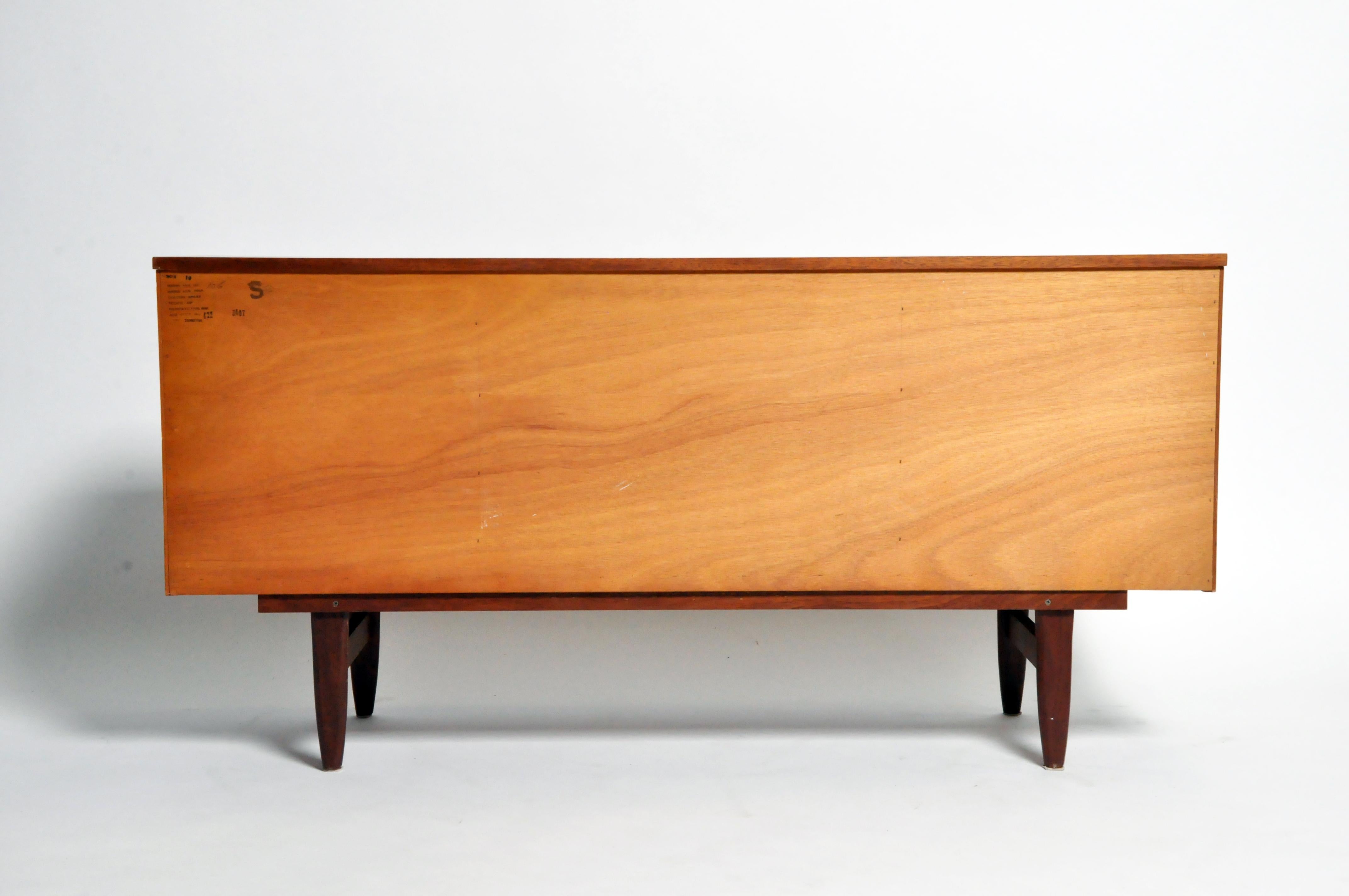 This meticulously made sideboard is a superb example of British midcentury furniture design. Though less famous than Scandinavian Modern, midcentury design’s British variant is very well-regarded for its iconoclasm and structural integrity. It also