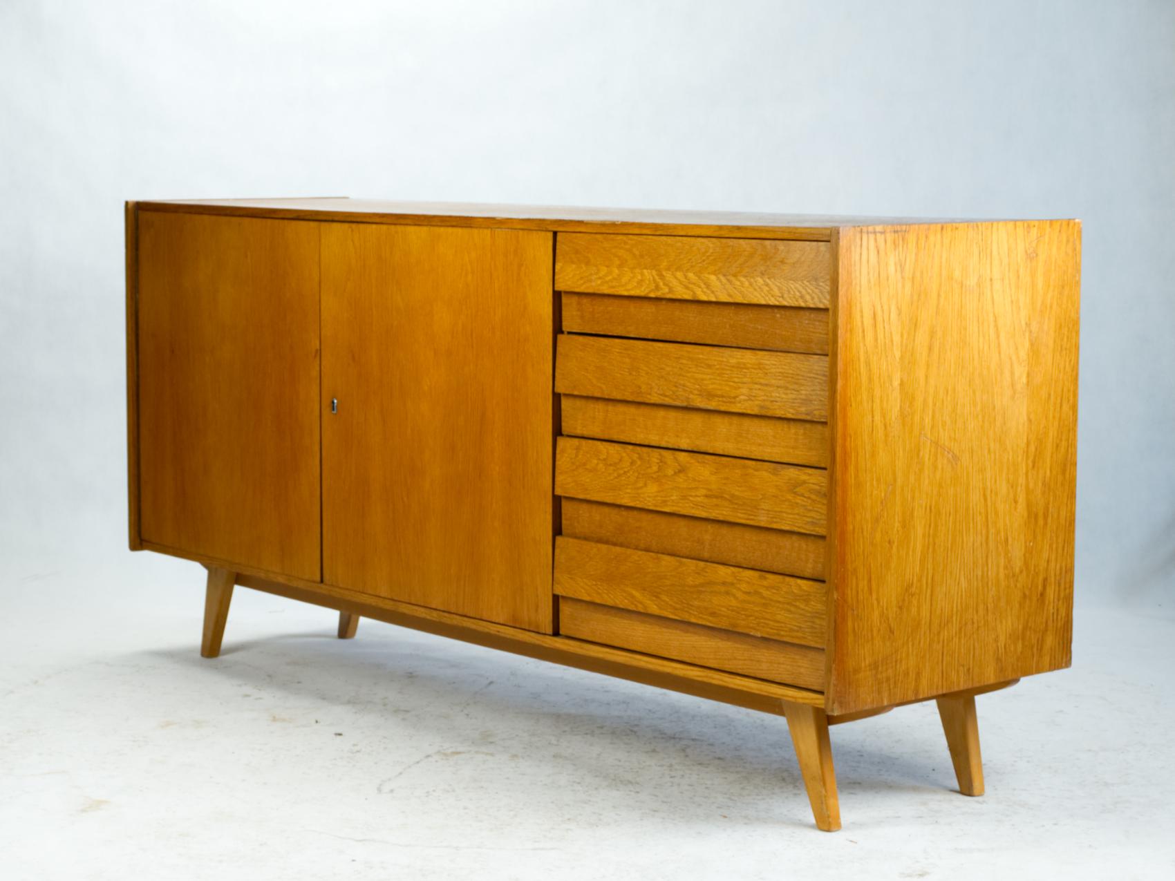 A wide cabinet designed by the Czech designer Jirí Jiroutek as a part of the famous series U-450 for the national enterprise Interior Praha. He began to work on U-450 series right after the ´58 Expo exhibition in Brussels. The success of the Czech