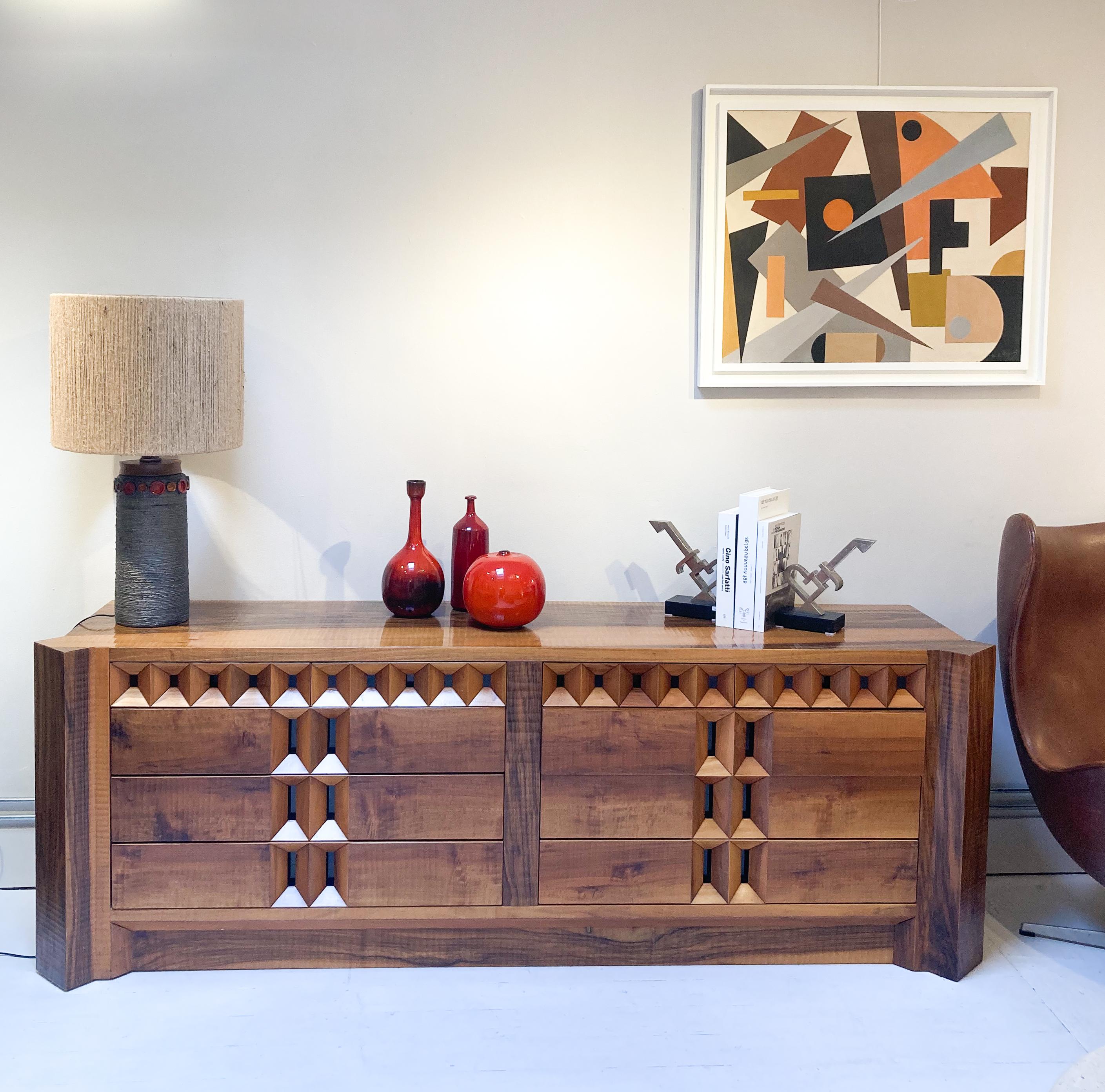 Mid-Century Modern sideboard with drawers by Guiseppe Rivadossi, 1970s


Giuseppe Rivadossi, born in Monteclana di Nave, Italy in 1935, still resides and works there today. He began his artistic journey as a woodcarver, creating works that