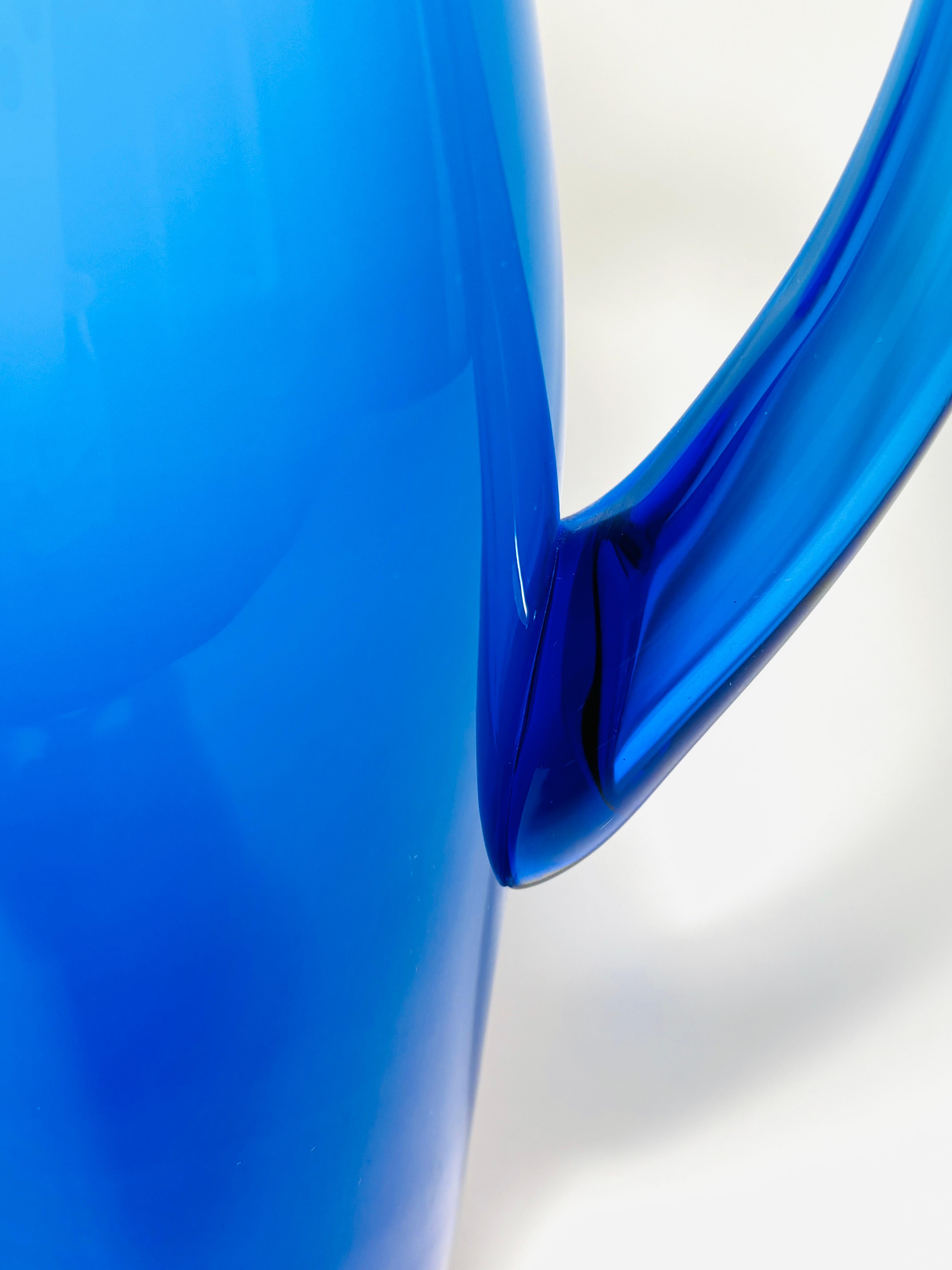 Mid Century Modern Signed Blue Cased Glass Pitcher. Orrefors Circa 1960 In Good Condition For Sale In West Palm Beach, FL