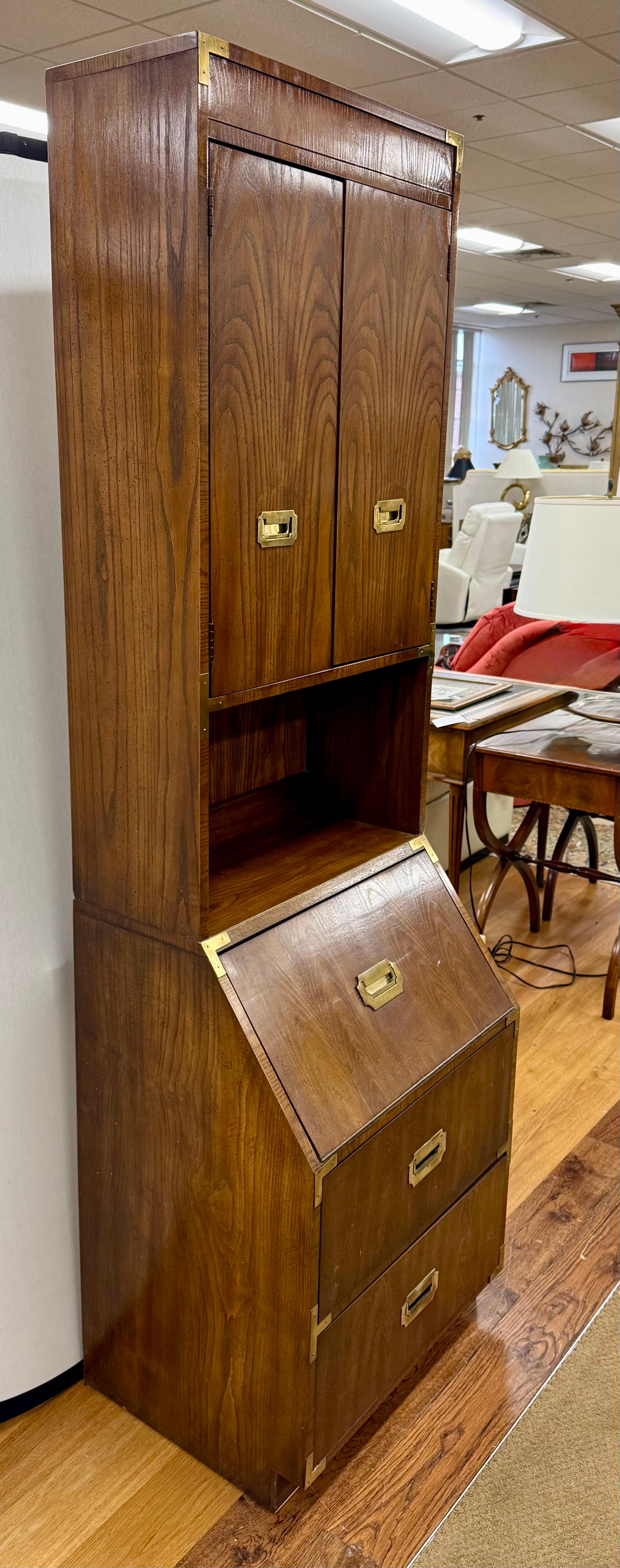 Walnut campaign dresser with two piece construction by coveted Dixie Furniture, the Campaigner line!   Storage drawers at bottom and top has shelves as shown.  Use in your bedroom, library, living room, etc. This Iconic 