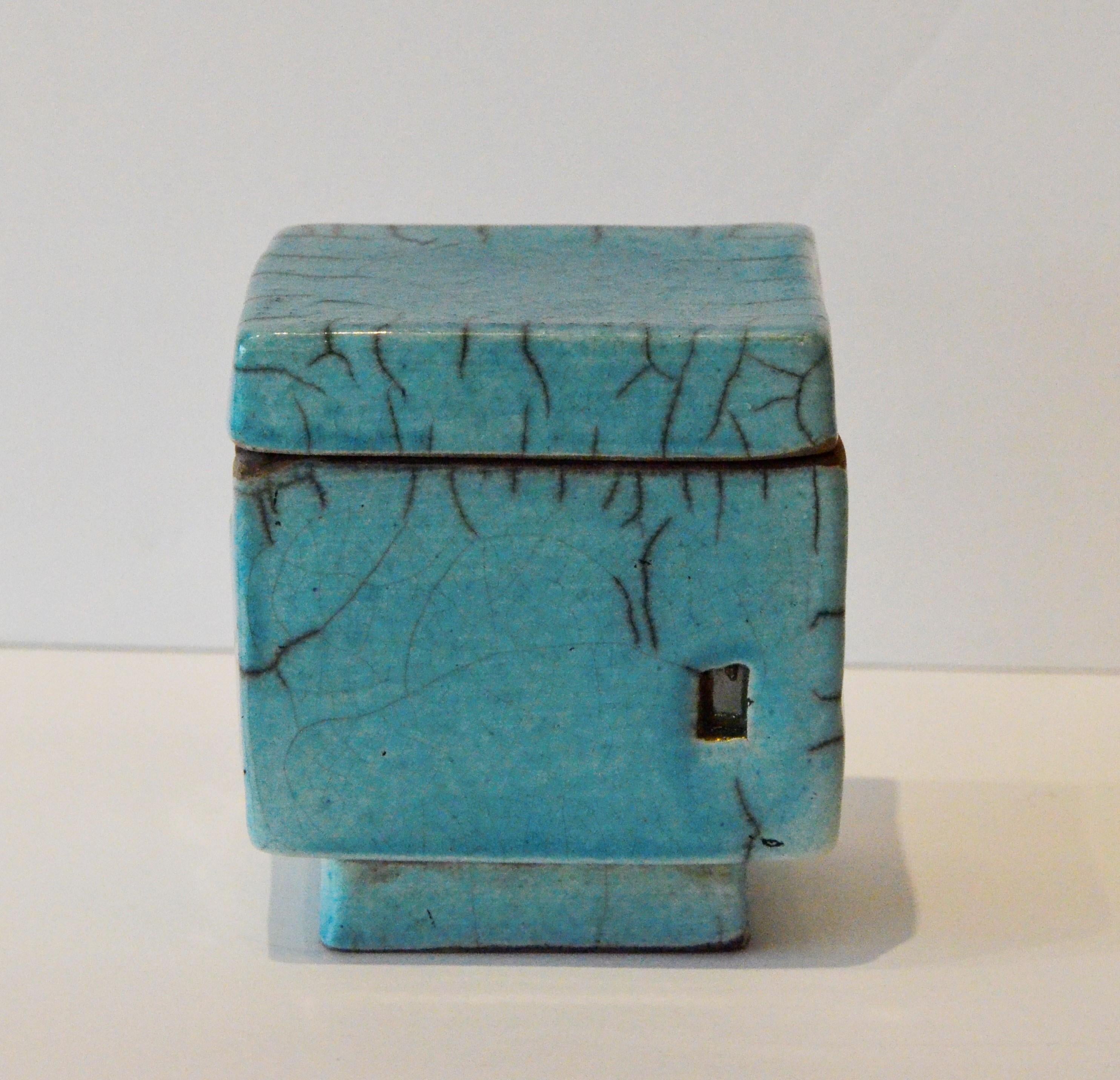 Offered is a Mid-Century Modern signed E Simpson, (possibly Elisa-the as the first name is illegible,) stamped blue clay pottery decorative square trinket box with lid. Not much could be found about the artist as the first name is illegible and