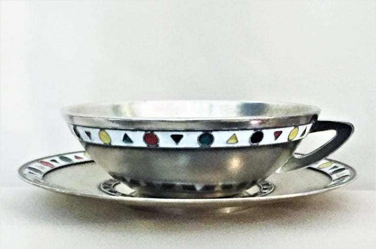 Rare!

Fully hallmarked, this elegant Mid-Century Modern set of eight coffee cups with saucers of unusual shape was made in the USSR in the 1960s out of 916° silver and decorated with a minimalistic geometric pattern of multicolored enamel. In