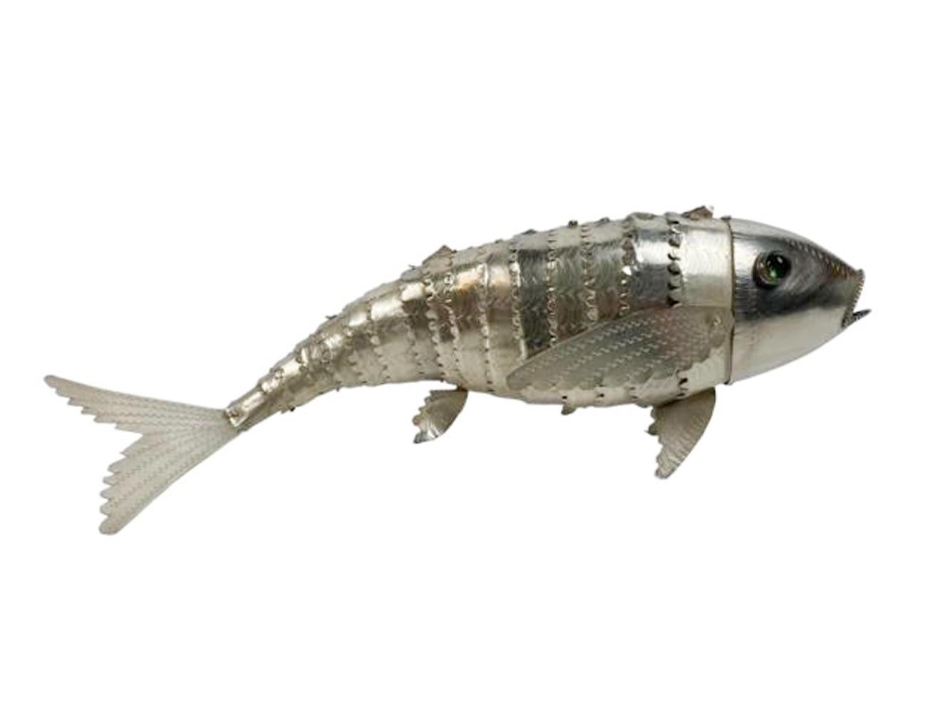 Mid 20th century silver plate articulated model of a fish with incised details and glass eyes.