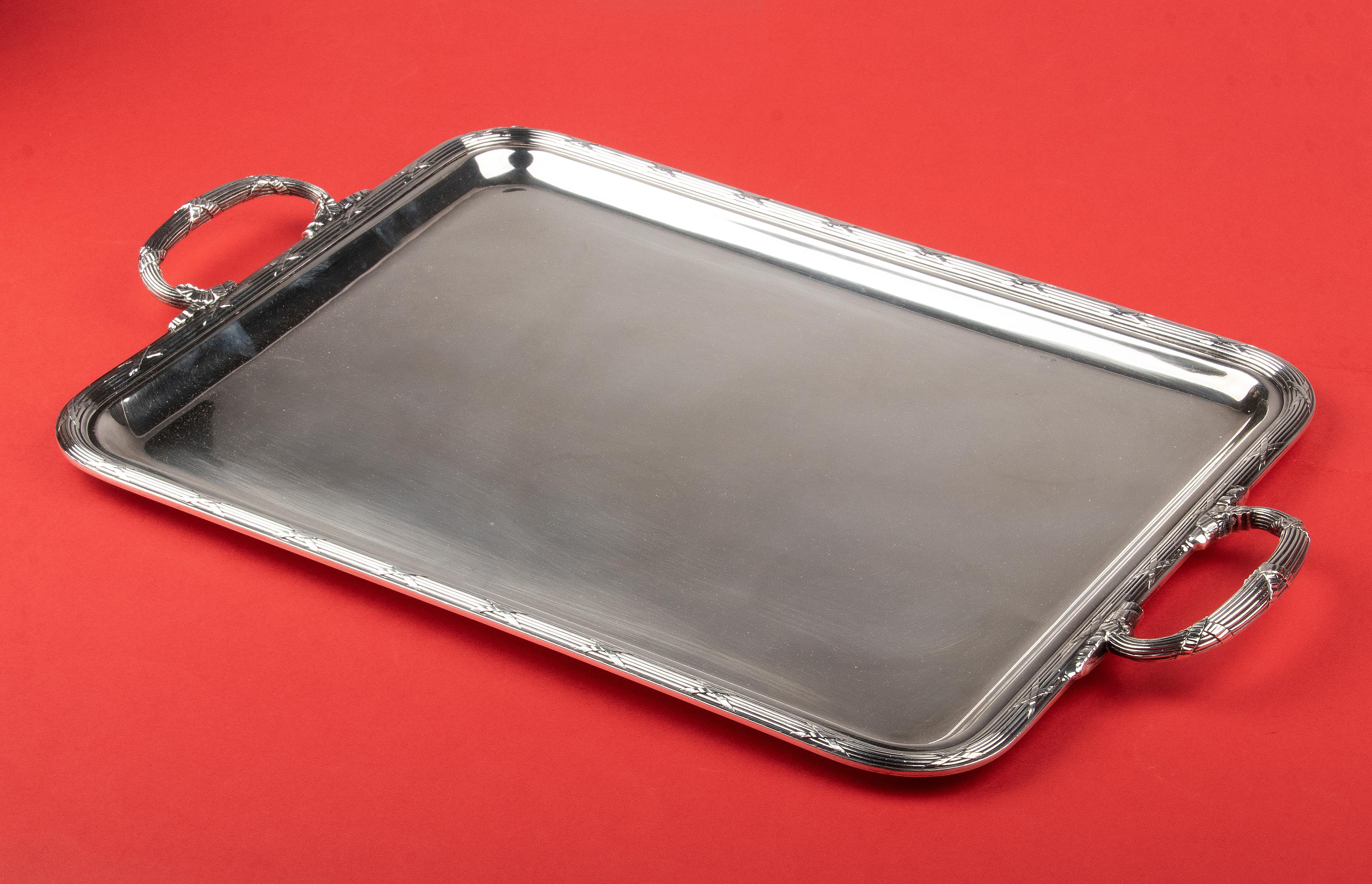 Beautiful silver plated serving tray from the French brand Christofle. The model is Rubans, an elegant and timeless design, also known as ribbon and bow. The tray is of a beautiful quality and is in very good condition.