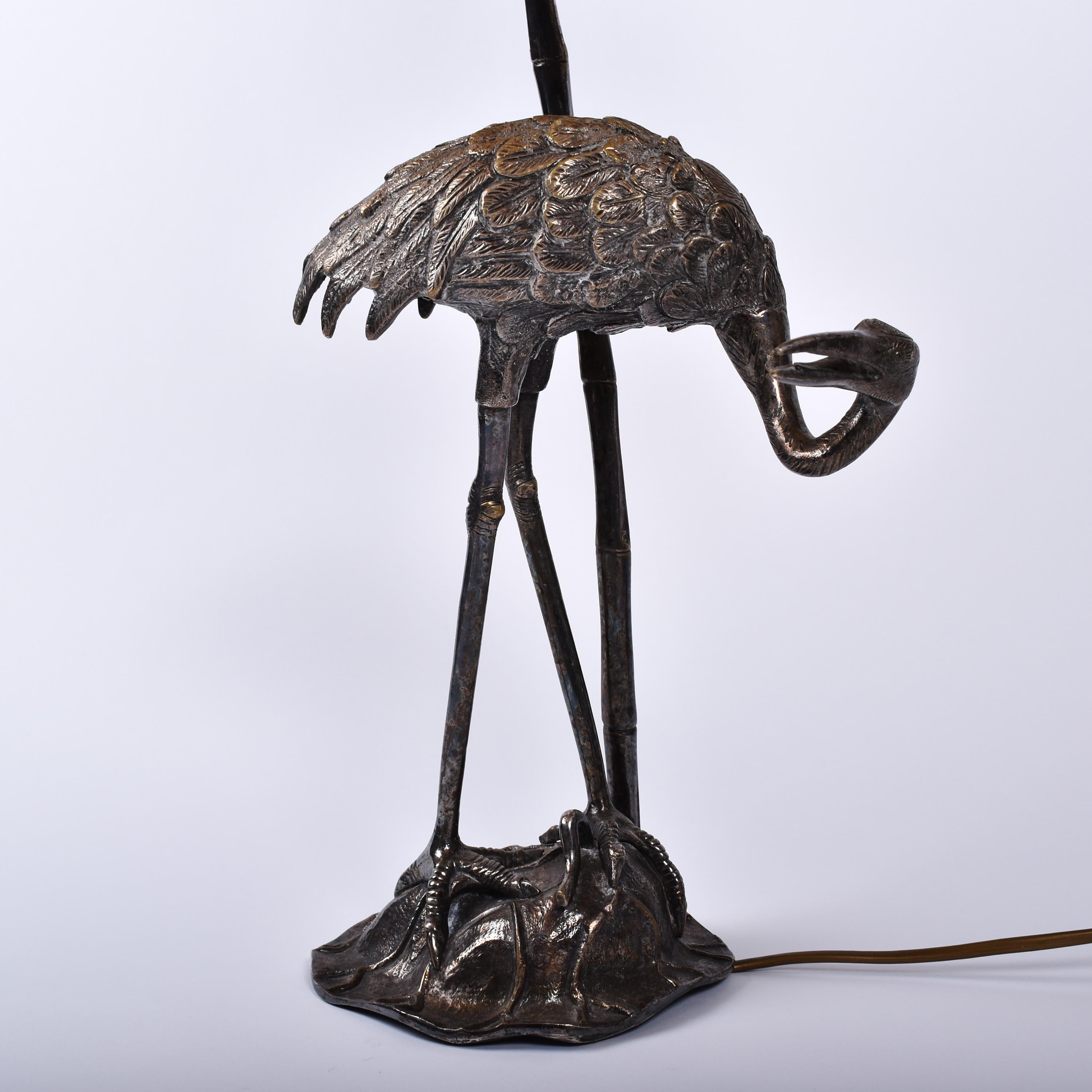 Mid-Century Modern silvered ibis table lamp by Maison Baguès.
Elegant lamp figuring an Ibis beside a bamboo. At the feet of the bird is a snake.
Nice sculptural and casting work, using the Maison Baguès typical faux bamboo, that is to be find on