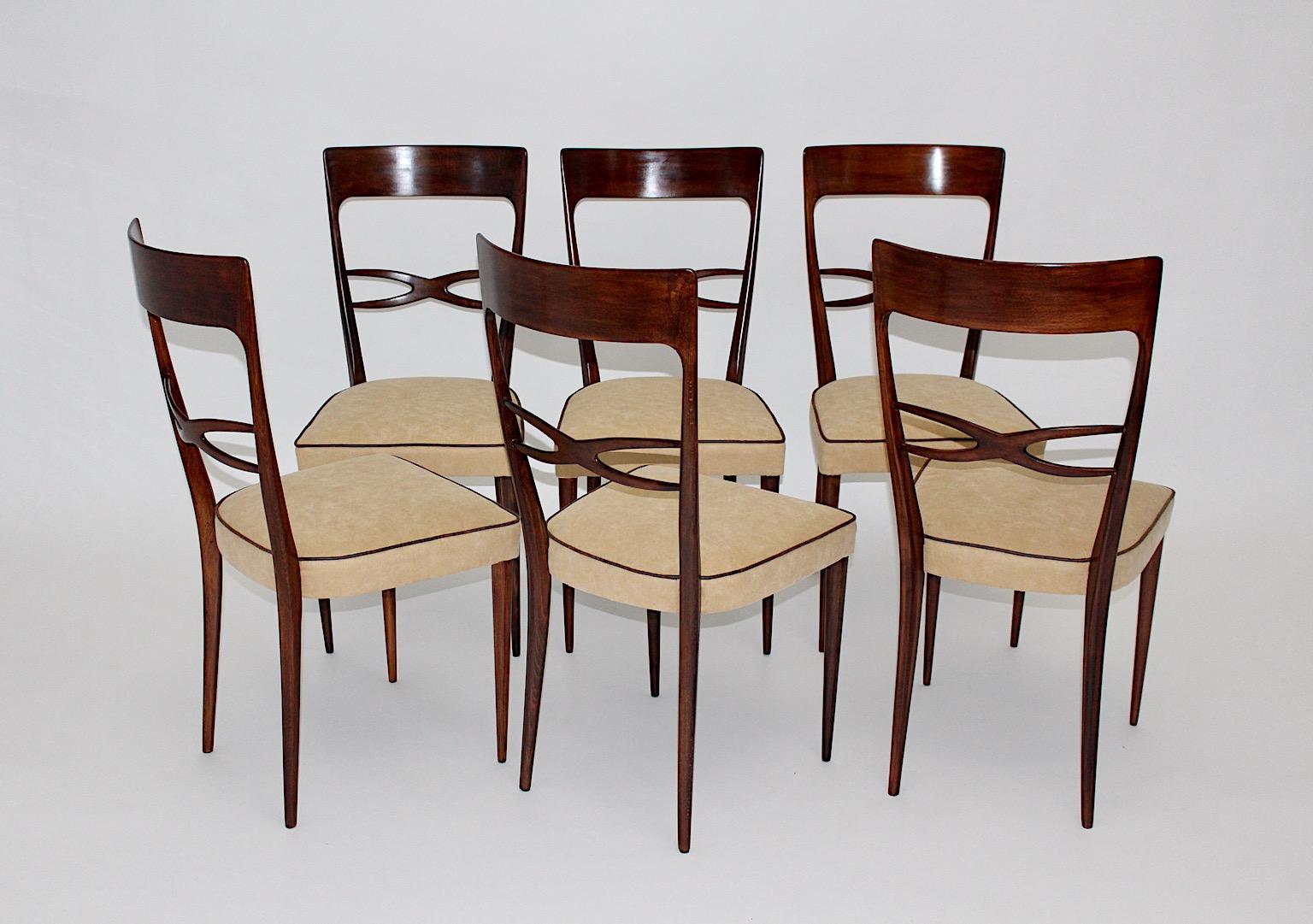 Mid-Century Modern set of six brown beech dining chairs by Melchiorre Bega attributed circa 1950 Italy.
The Italian Mid-Century Modern beech dining chairs is top-quality with walnut stained beech frame, while the upholstery shows butter cream