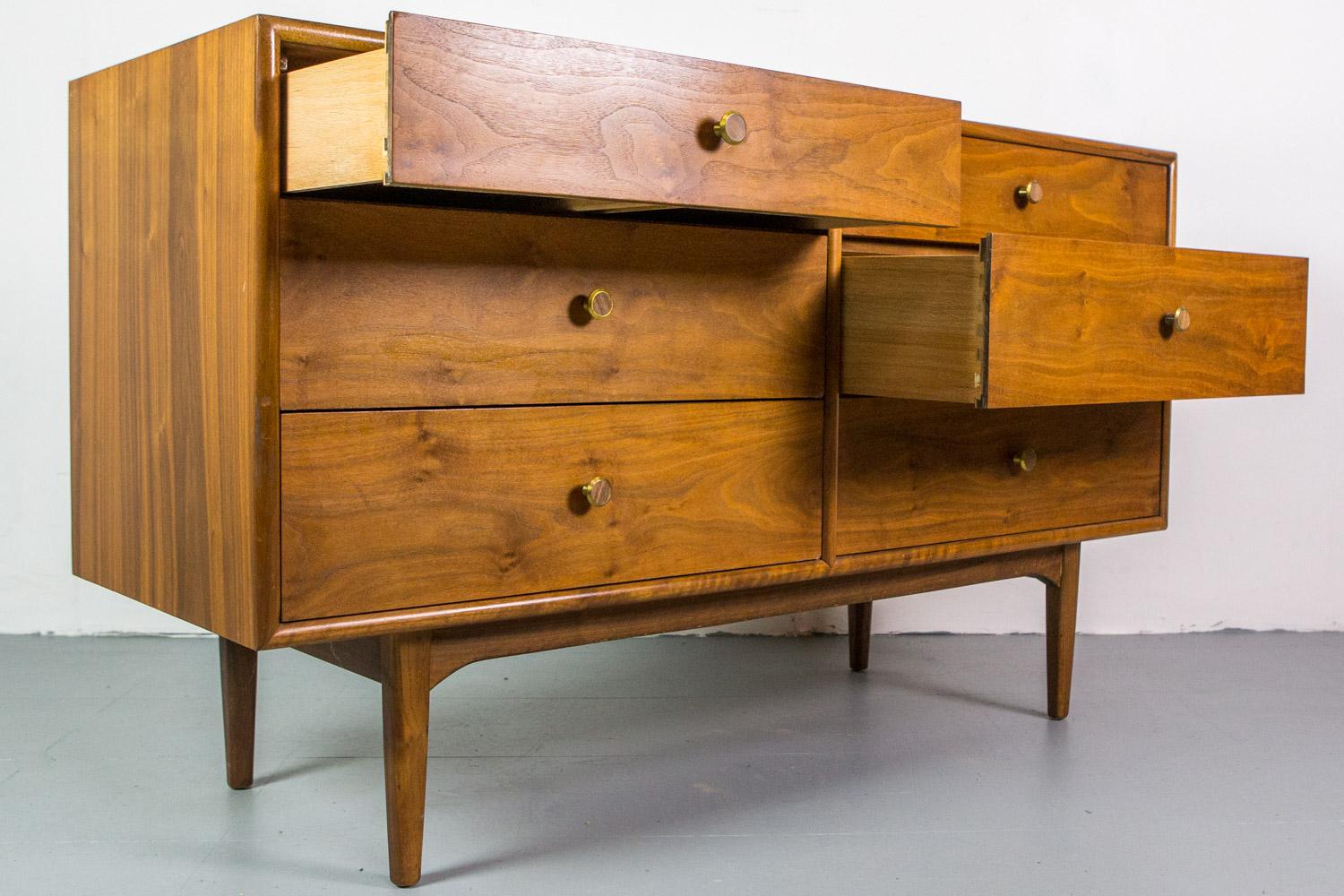 Mid-Century Modern six-drawer dresser by Kipp Stewart for Drexel. Superior quality and construction in nice figured walnut.