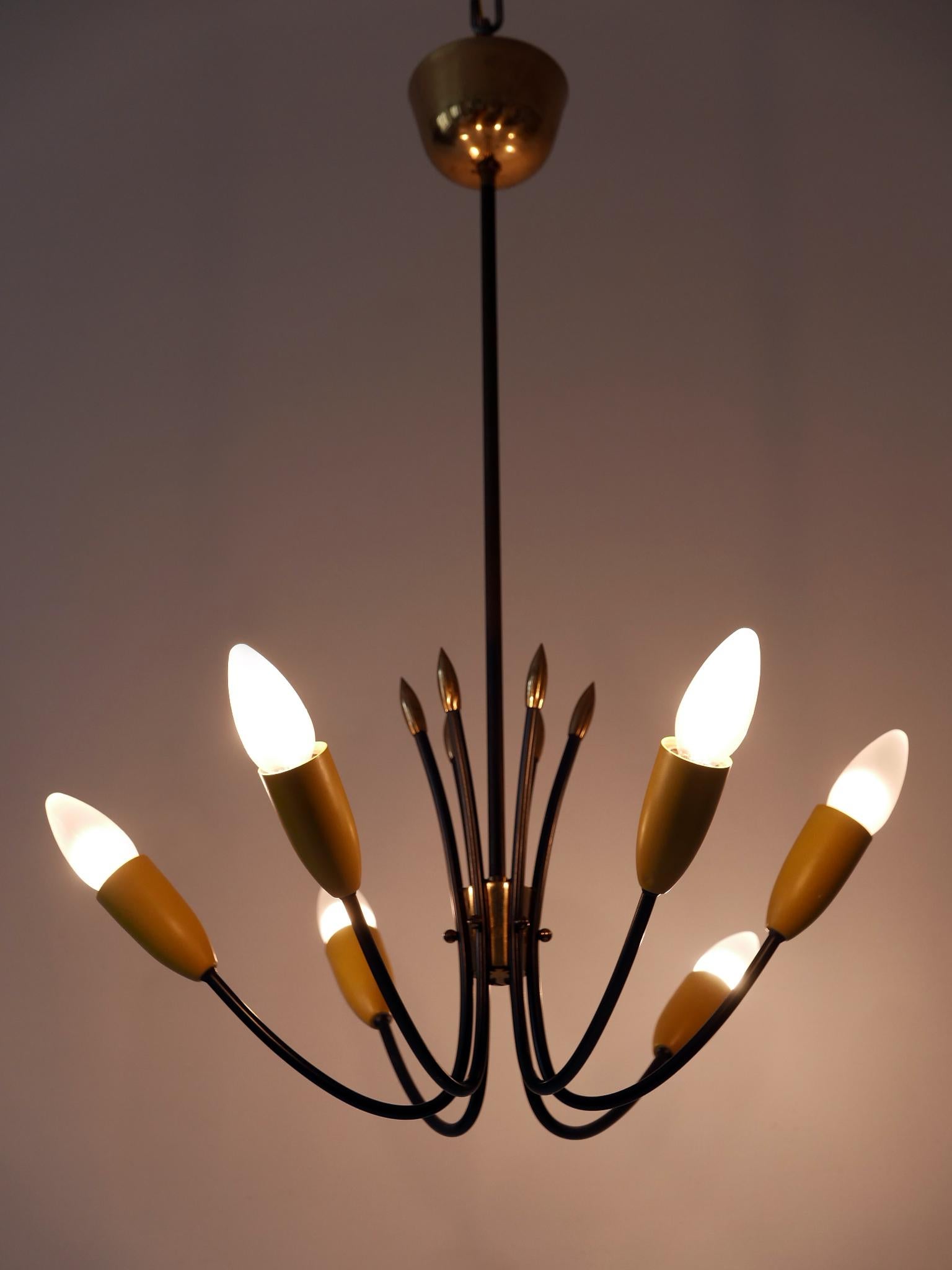 Lovely and highly decorative Mid-Century Modern six-flamed Sputnik pendant lamp or chandelier. Designed & manufactured in Germany, 1950s.

Executed in brass & metal, the pendant lamp / chandelier is executed with six x E14 / E12 Edison screw fit