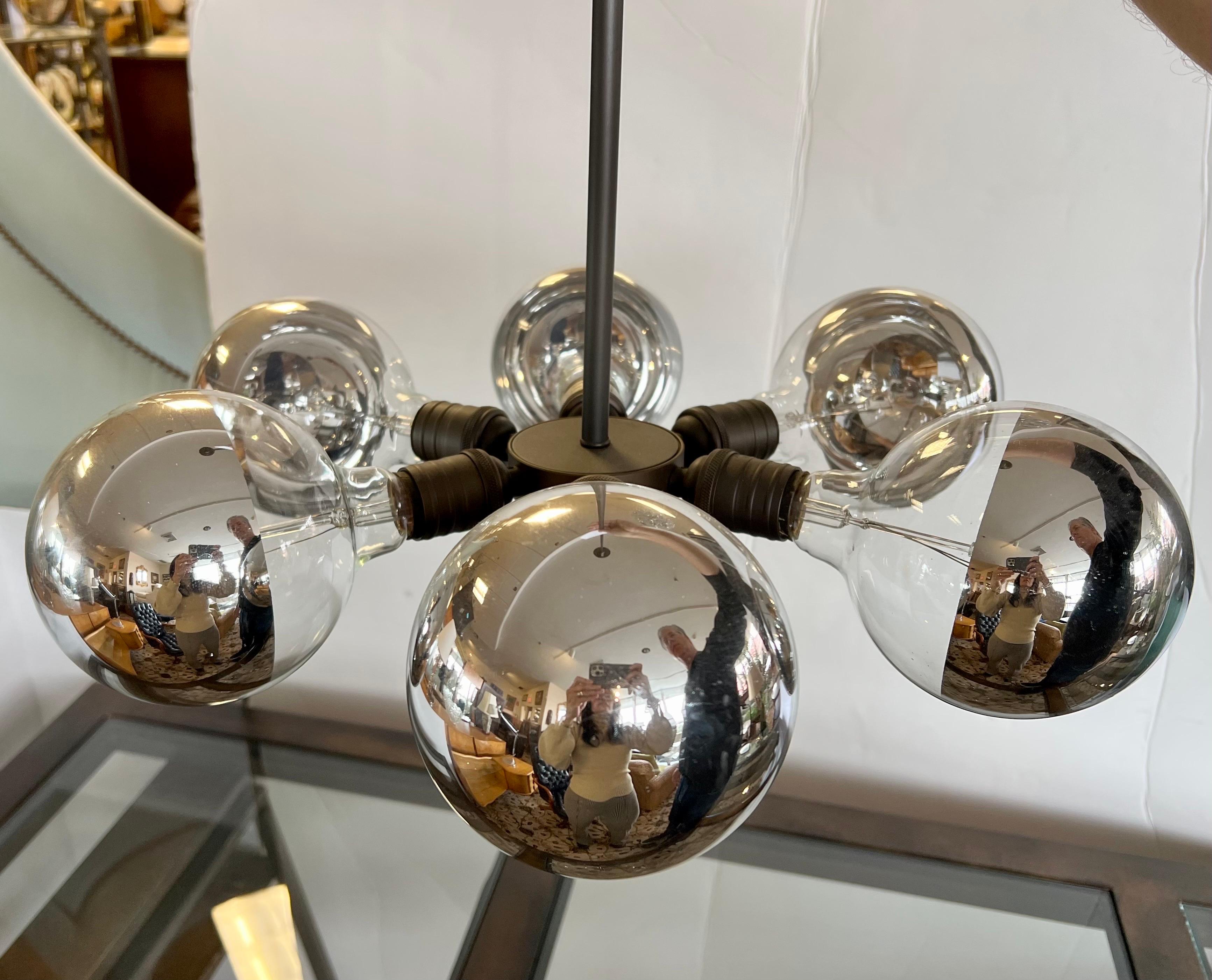 Iconic six light sputnik chandelier circa 1970's. Wired for USA and in perfect working order. The six sputnik bulbs form an atom which is round and connected by center pole. The dimensions below include the height of the pole in the overall height.