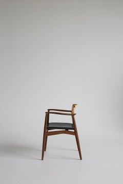 Mid-Century modern SJ.67 Captain chair, cane, by Erik Buck. New edition