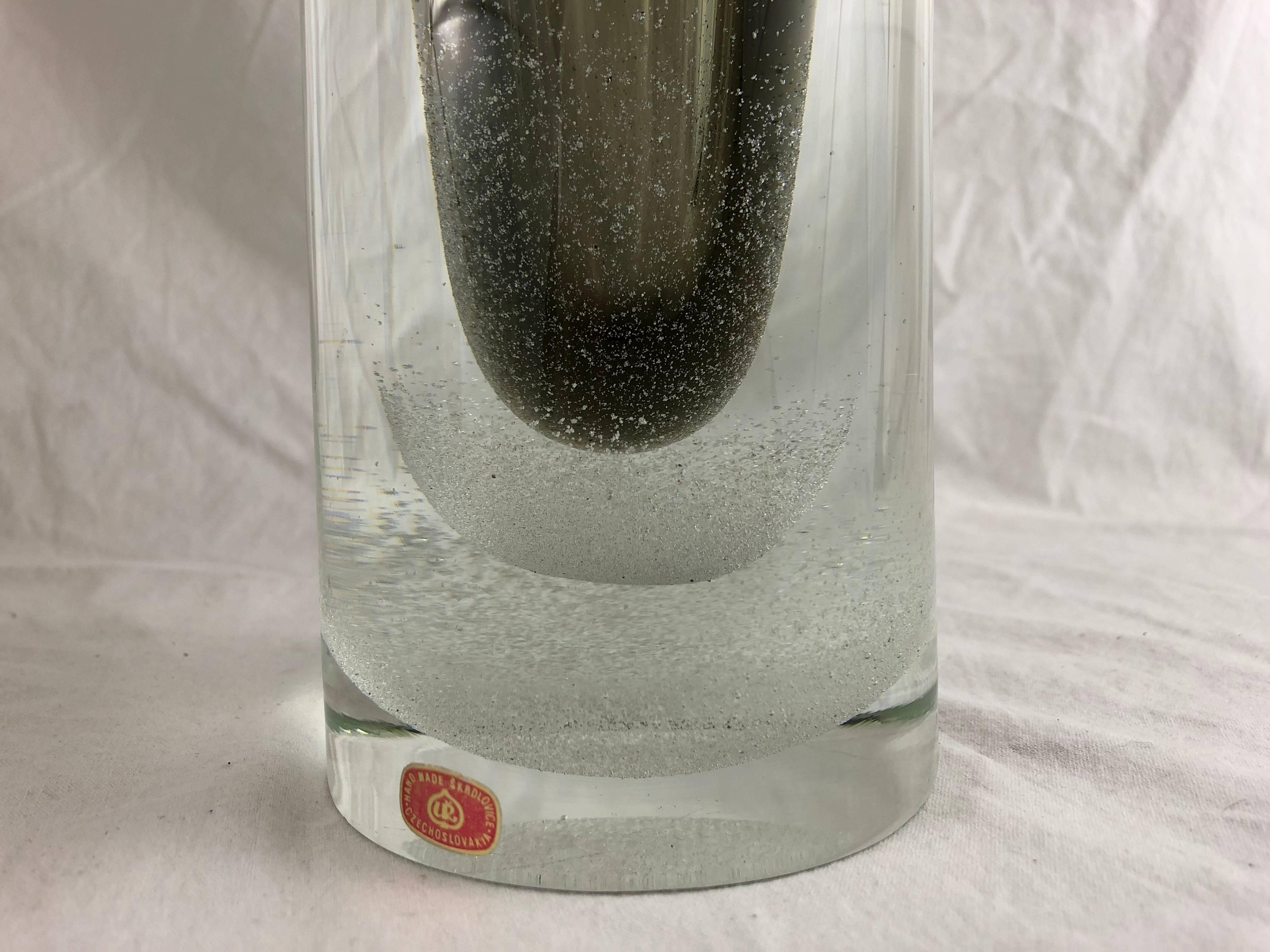 Mid-Century Modern Skrdlovic Czechoslovakian glass vase 

Cased clear glass with layers of smoky grey with air bubbles in layers at the bottom. 

Measures: 9.5