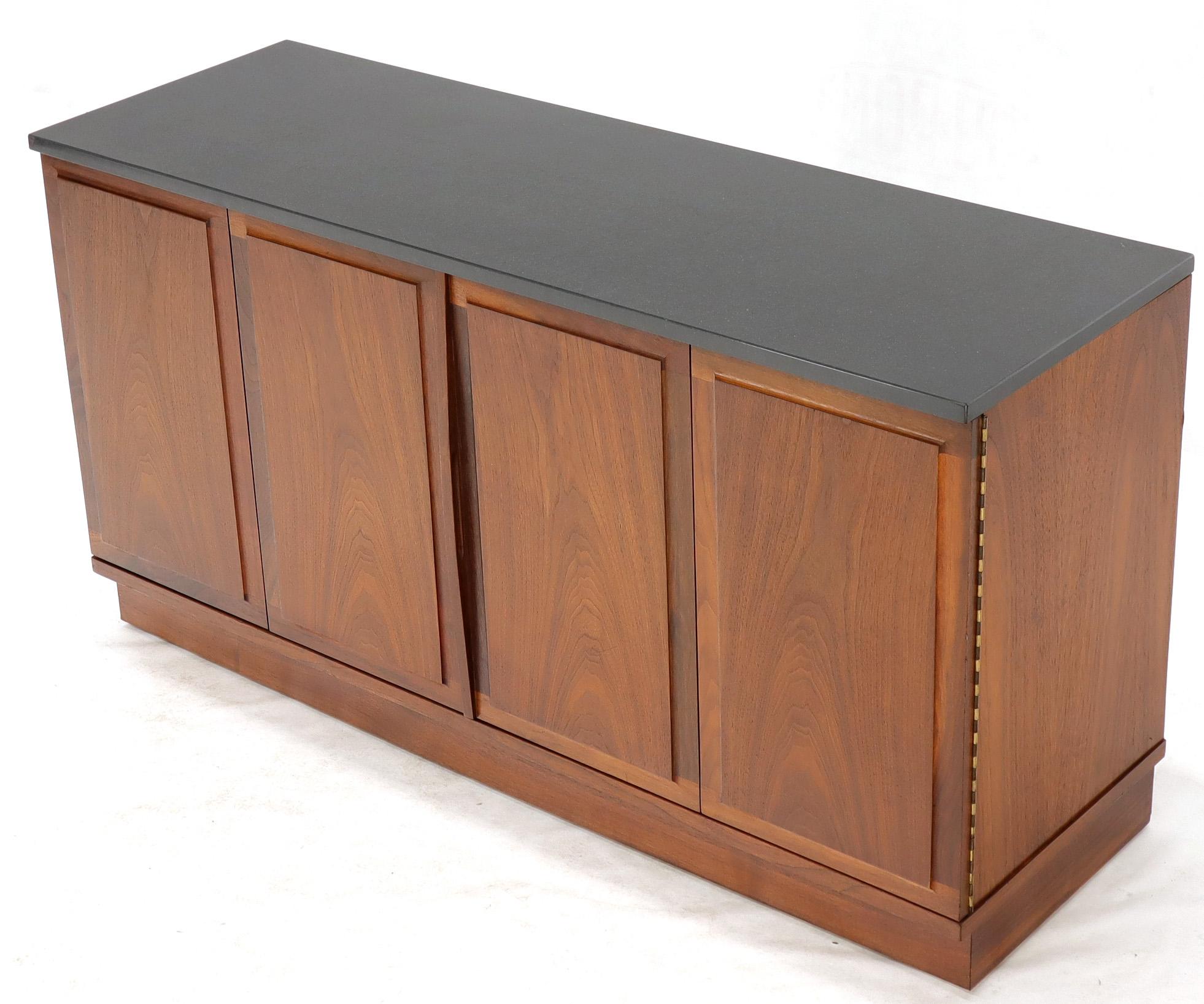 Mid-Century Modern double accordion doors walnut credenza storage cabinet with slate top. Dramatic vintage oiled walnut wood grain. Excellent condition. Milo Baughman influence.