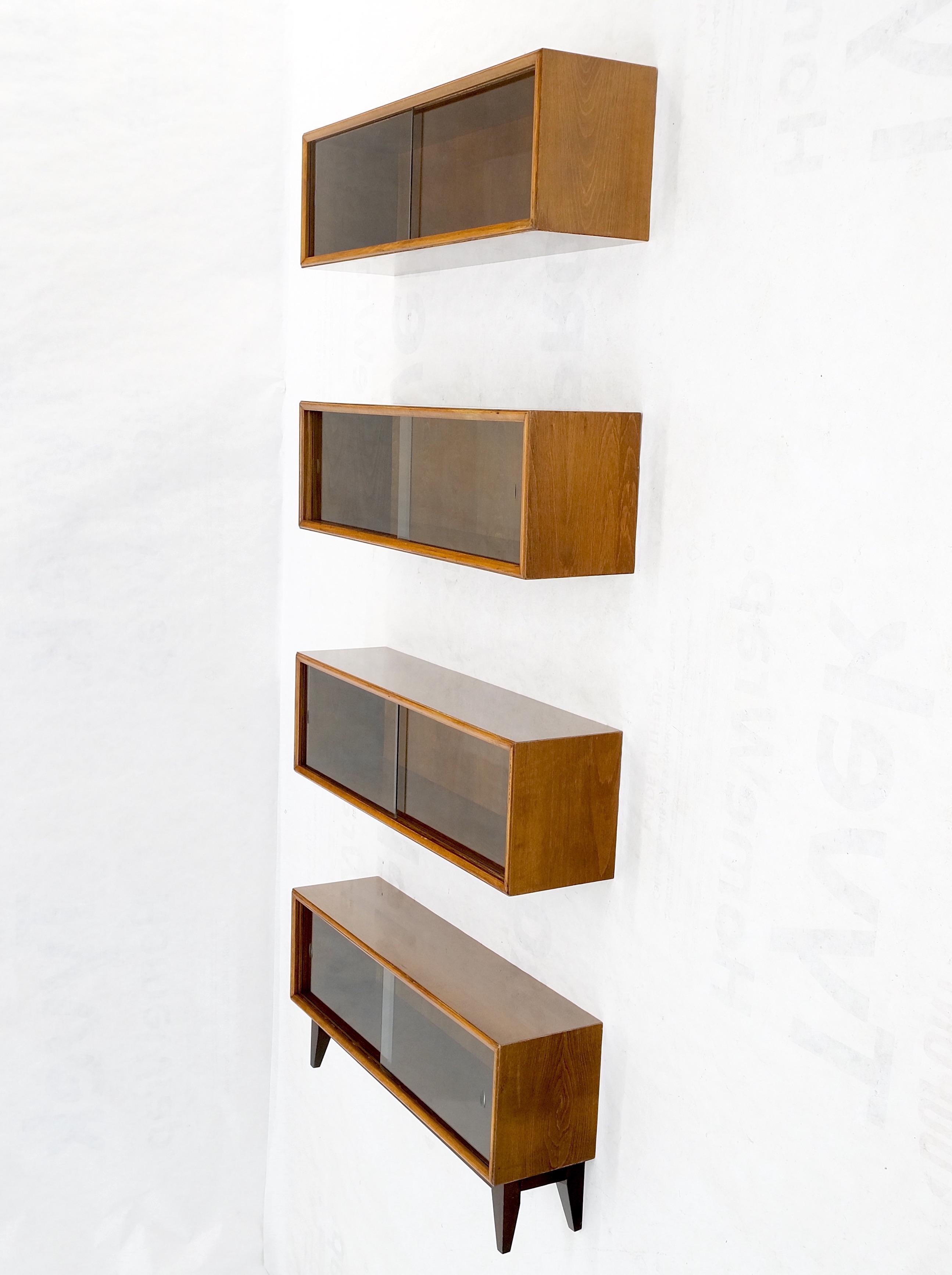 Mid-Century Modern sliding glass doors 4 bays stacking or hanging bookcase.
Made in Yugoslavia.