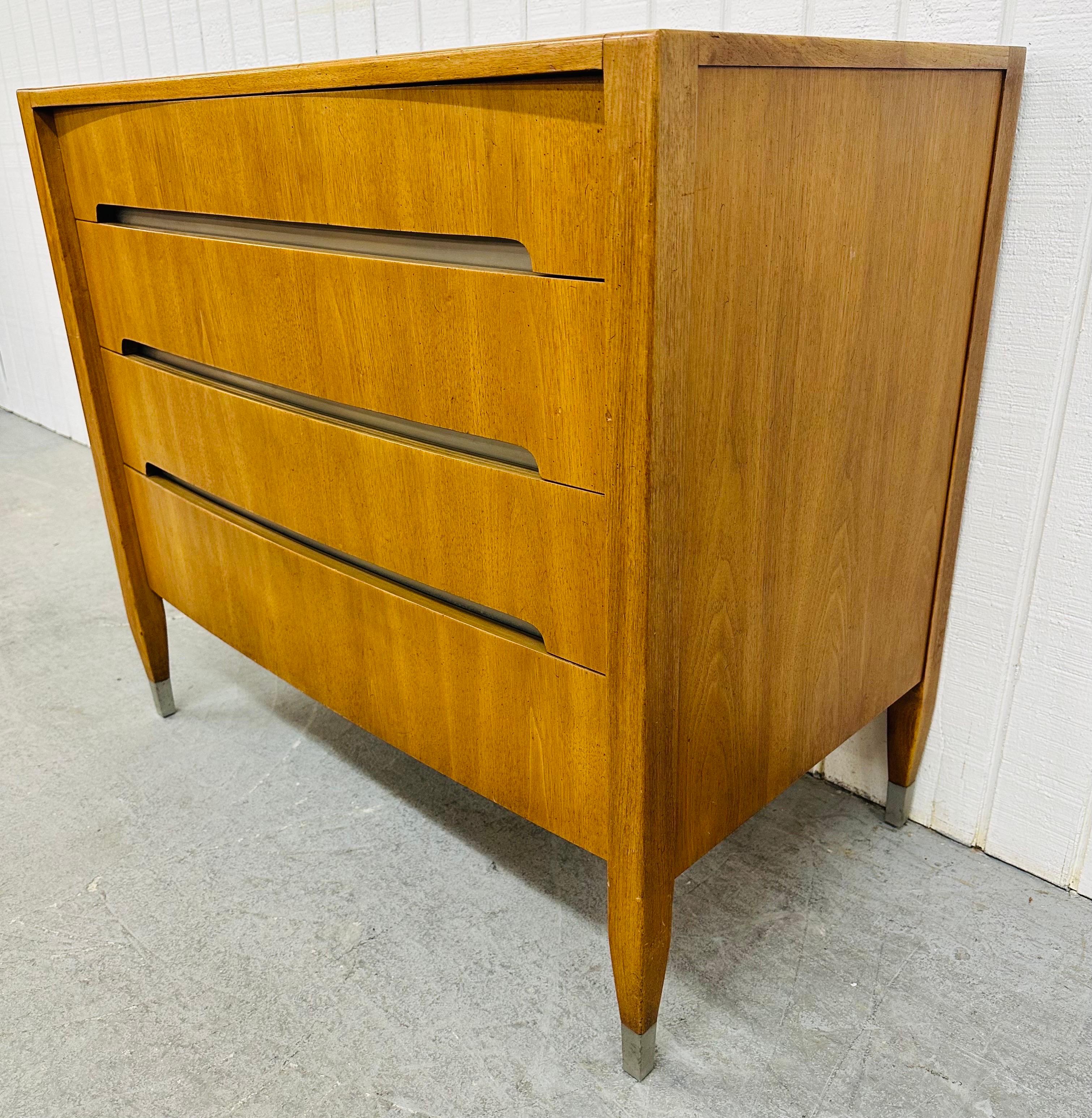 This listing is for a Mid-Century Modern Sligh Walnut Bachelor Chest. Featuring a straight line design, four drawers for storage, recessed handles, chrome trim with caps on the feet, and a beautiful walnut finish. This is an exceptional combination
