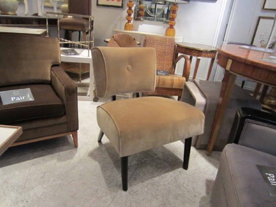 Mid-Century Modern slipper chair on ebonized legs, covered in original brushed cotton.